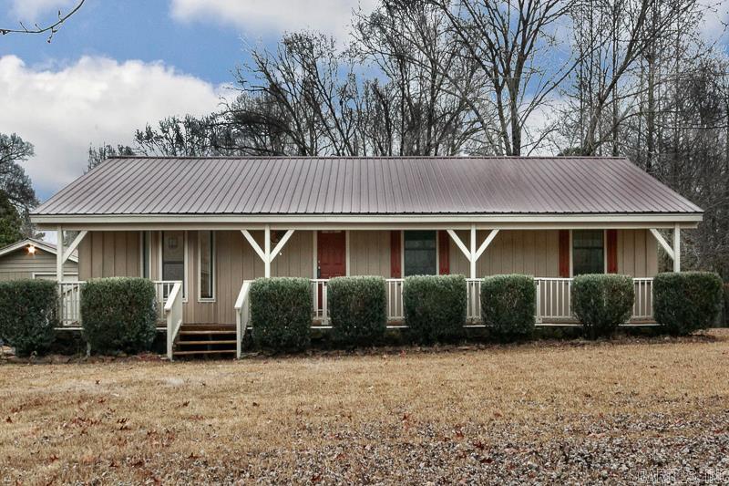 Country living, but close to town and schools. Come see this beautiful remodeled home! This home sits on almost 1 acre and offers 4 bedrooms/3 bath.  4th bedroom can be used as a bonus room, game room or in-law suite.  The possibilities are endless! Large kitchen with breakfast bar and new electric stove.  Heat and air unit is only 2 years old.  Garage/shop has electric and a/c.  You don't want to miss this!!