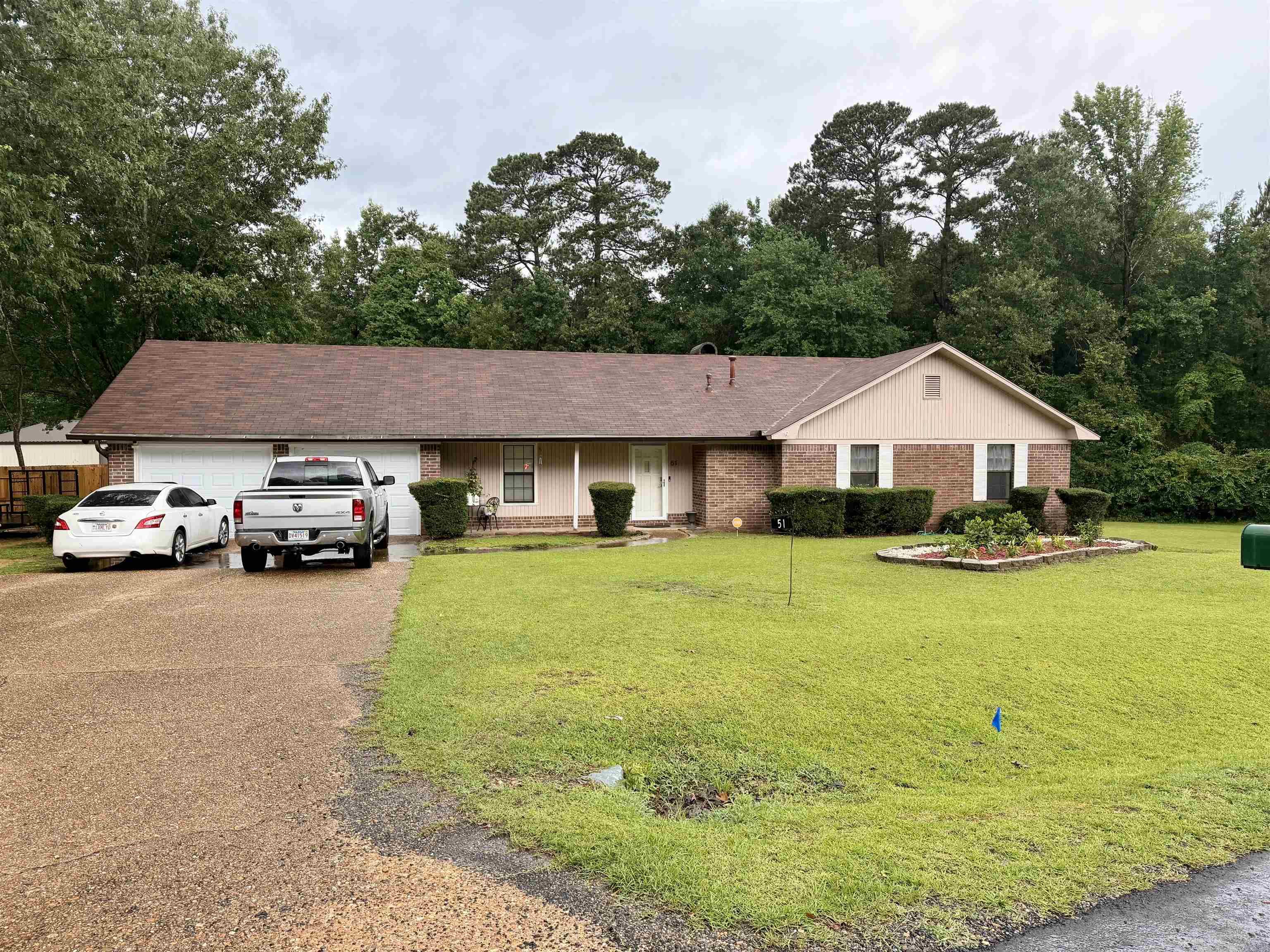 Charming, well-maintained 3 bedroom 2 bath home at 51 Sassafras Dr, Magnolia, AR — 1,672 sq ft with beautiful wood floors. Seated on nearly an acre, the large lot offers a private backyard oasis with a privacy fence and a pool area perfect for relaxing and entertaining. Lot size, acreage, & square footage taken from courthouse records.