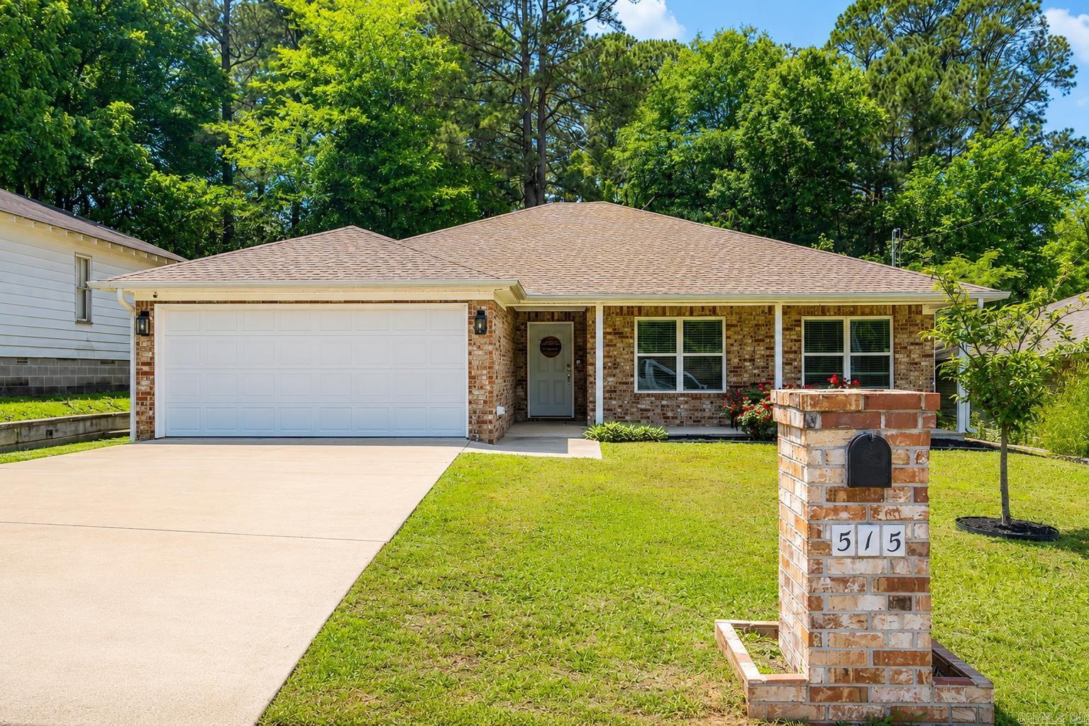 Start your next chapter in this beautiful 3-bedroom, 2-bath home, offering 1,510 sq. ft. of open living space. Built in 2019, this move-in ready home features gorgeous wood flooring throughout the main living area and a cozy gas fireplace that creates the perfect gathering space. The kitchen is designed for both function and style with granite countertops, stainless steel appliances, an apron-front sink overlooking the living area, and a refrigerator that conveys with the home. Granite countertops continue throughout both bathrooms, adding a cohesive modern touch. Enjoy the convenience of a dedicated laundry room, a two-car garage, and a fully fenced backyard perfect for pets, play, or entertaining. Located near the heart of historic downtown Benton, you'll love the convenience and character that this home brings.