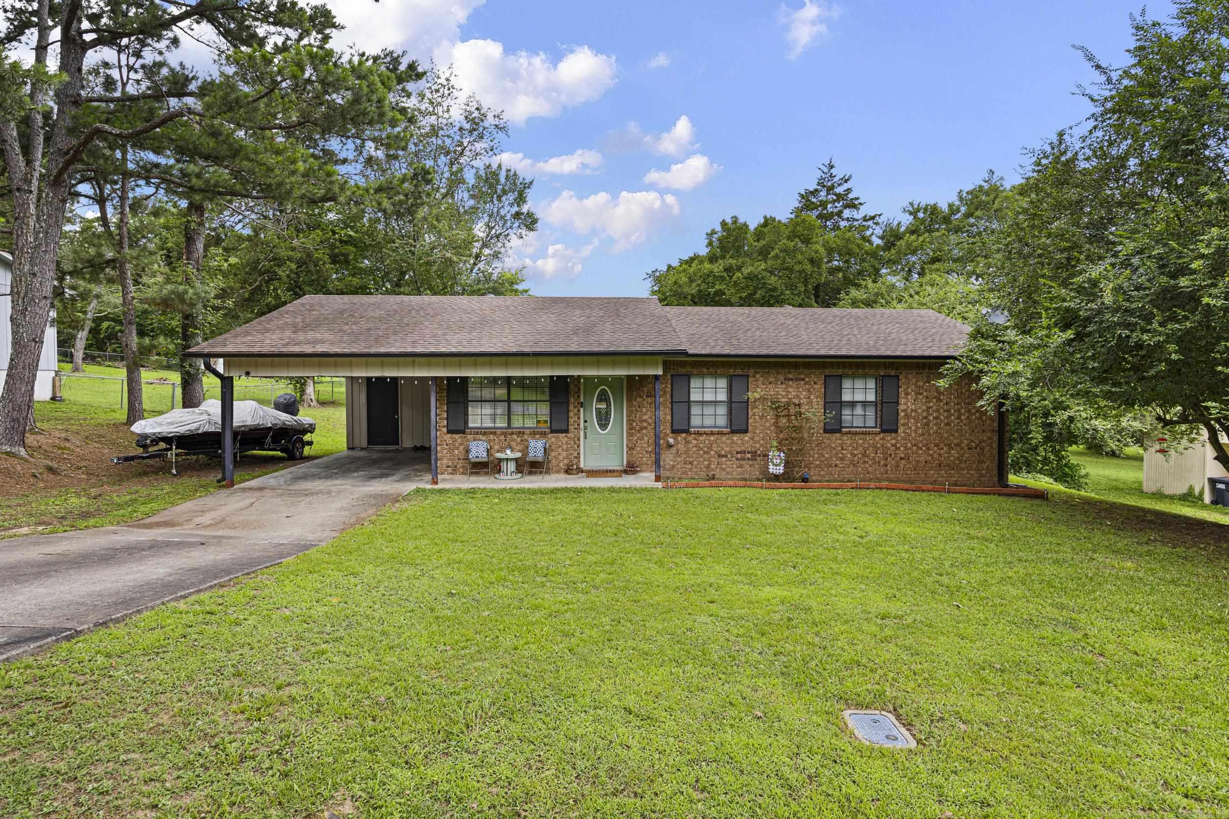 Welcome home to this charming 3-bedroom, 1.5-bath property tucked away on a quiet dead-end street in Russellville. From the moment you step inside, you’ll appreciate the many recent updates, including new flooring, fresh paint, updated bathrooms, new appliances, new doors, and modern fixtures throughout. The spacious living room flows seamlessly into the eat-in kitchen, creating the perfect space for everyday living, entertaining friends, and gathering with family. Need extra storage? This home offers a large storage room off the attached carport plus abundant attic storage, giving you plenty of room for all your seasonal items, hobbies, and extras. Enjoy your morning coffee on the welcoming front porch or unwind in the evenings on the back deck overlooking the backyard. Conveniently located just minutes from I-40, Arkansas Tech University, schools, shopping, dining, and everything Russellville has to offer, this home combines comfort, convenience, and value in one attractive package.