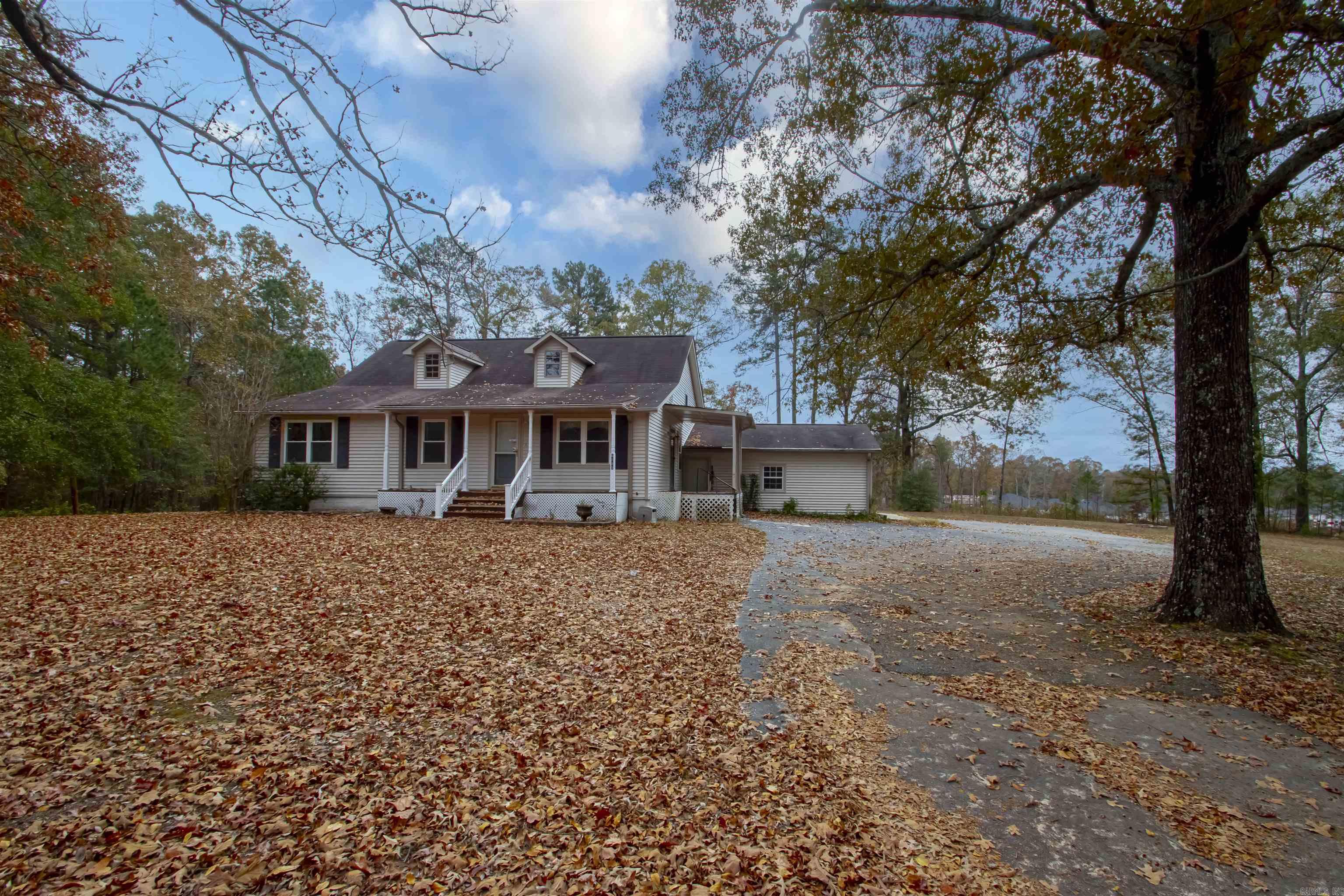 Welcome to your opportunity to transform this spacious 4-bedroom, 3-bathroom home into your dream retreat.  Nestled on over 3 acres in pristine Saline County, this property offers endless possibilities for those with vision and a love for nature.  Imagine the potential for gardens and outdoor activities?  The home features a large family room, dining area and cozy nooks, perfect for entertaining or relaxation.  Some of the photos in this listing have been virtually staged. Book your showing today!