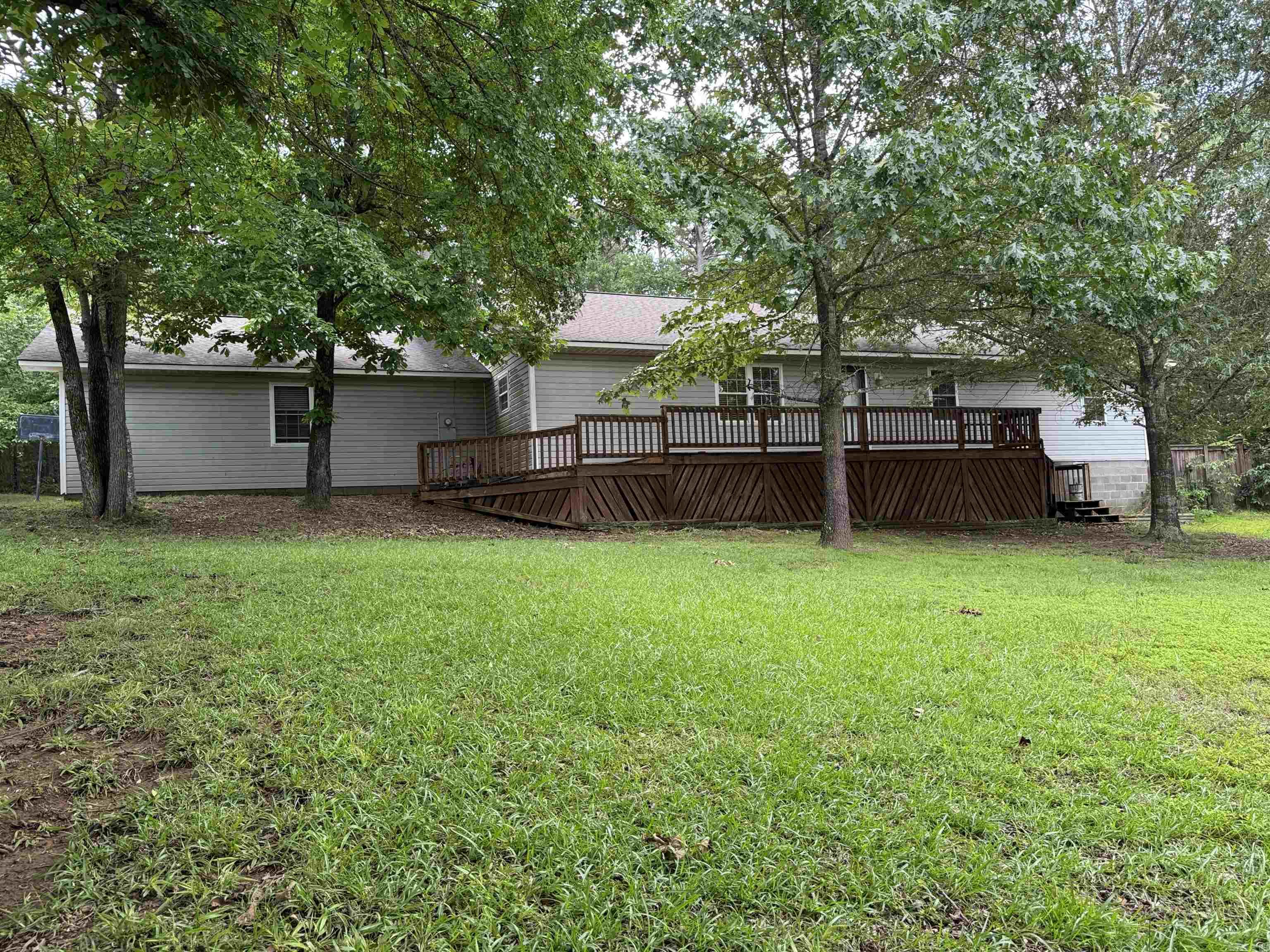 3 bedroom, 2 bath, 1,792 sq ft home sitting on 3 lots in the Higden area. Home has concrete drive going into the 2 car garage. Property has a fenced back yard, storm shelter and a 12 x 16 storage shed. Kitchen has tile floor, eat in bar, and black appliances. Nice size living room with outside access to the covered patio area. Home also has a large laundry room and an extra room that can be used as a 4th bedroom or an office. Close to Greers Ferry Lake with boat launch just down the road. This one is a must see.