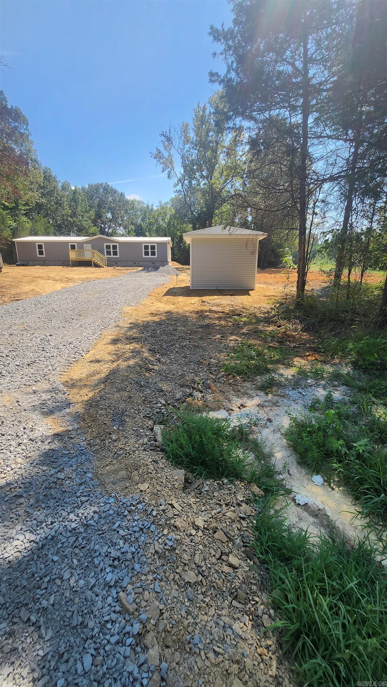 2023 mobile home with brick skirting sitting on 3 acres. 4 bed/2 bath and 1865 sq feet of living space. All stainless steel appliances. Large walk-in closets. Master bathroom has walk-in shower and garden tub. Large front porch and back deck.