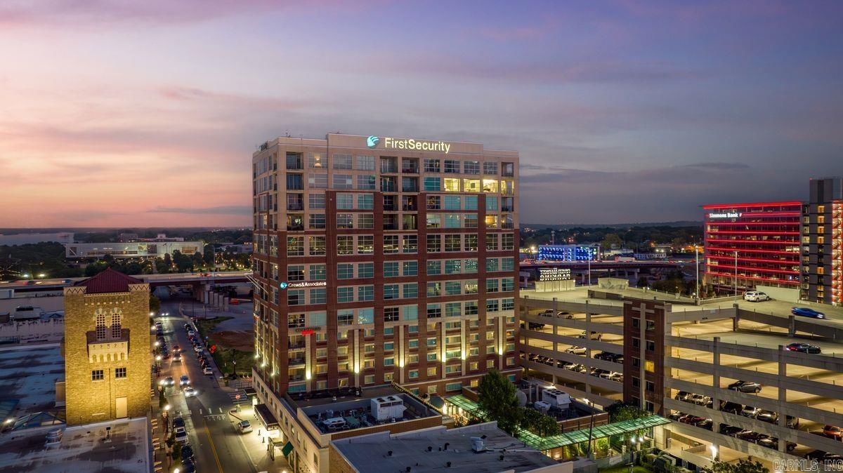 Luxury Penthouse w/ Panoramic River Views! RARE opportunity for a spacious 2 bedroom/2 bath top floor (14th) Penthouse in the First Security Building, perched at President Clinton Ave & Sherman! Over 2200 SF w/ sweeping river views to the east and south! High ceilings, open flow, & large, inviting wrap around balcony contribute to peace & serenity from the moment you walk in the door.  Watch the sunrise w/ your unobstructed view of The Clinton Library and beyond as the river winds away.  The rooms are all expansive making this high rise condo feel like a home! Floor to ceiling windows to the east with full river views from both bedrooms, living room, dining area & kitchen. Very secure, multi use building with FOB only access to the building, the elevators and to your floor.  One parking space, in gated secure street level garage, owned by the seller to convey with sale.  Additional spaces may be rented from the city. Enjoy life as it can only be experienced in the heart of Little Rock's downtown River Market District. Residents love the secure, easy location and convenience to wonderful restaurants & diverse entertainment as well as utilizing the Courtyard by Marriott for guests!