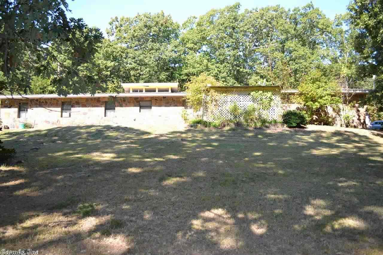 Spacious Fixer Upper, California Ranch Style with 10 acres to roam. Open beam ceiling, large cut rock fireplace with insert, block exterior walls and rock covering front of home. Metal roof and 2 car garage. Ready to be fixed up and lived in or a good investment property.