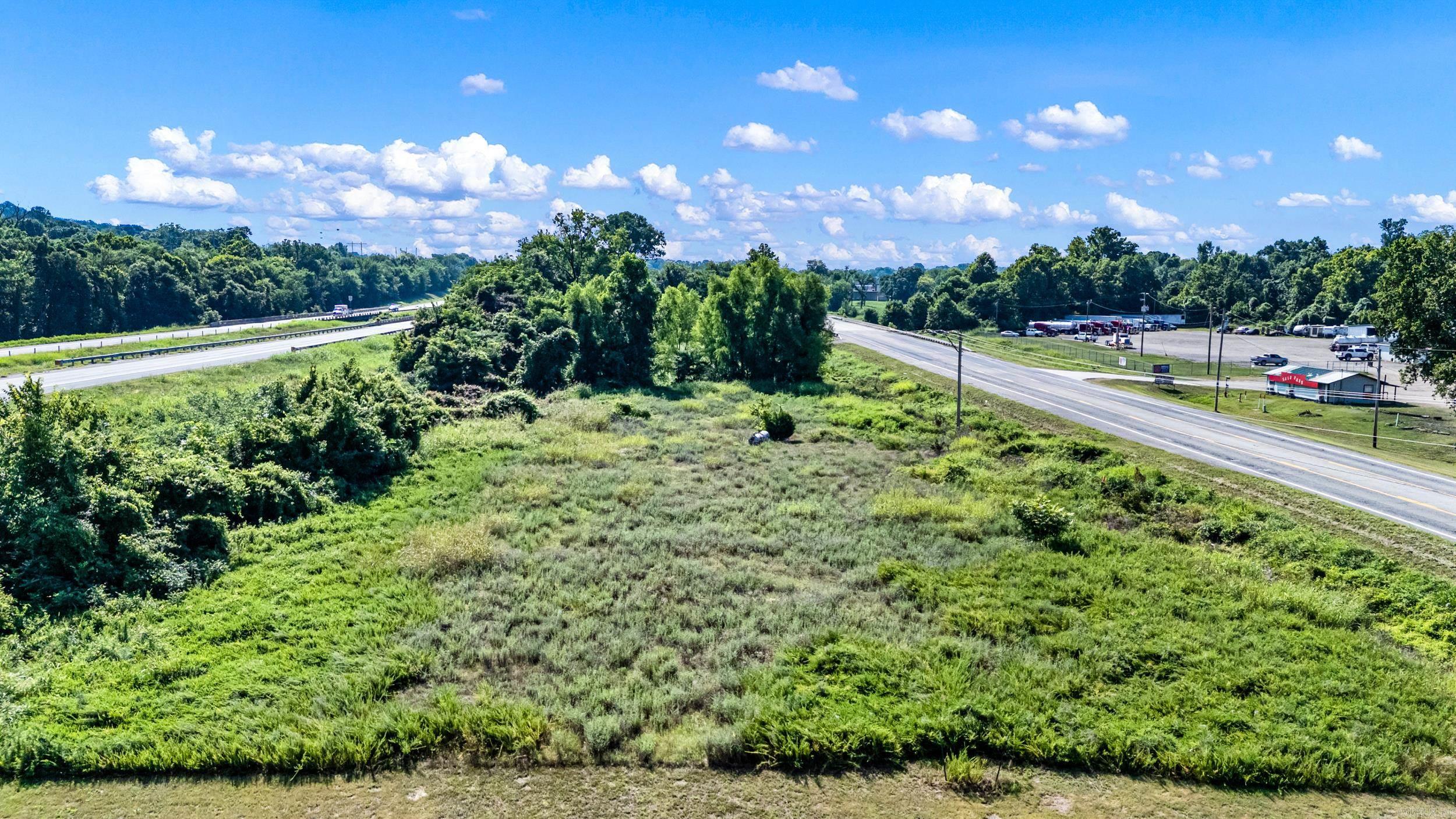 Prime Commercial Opportunity! This 2.59-acre commercial tract is ideally located between Interstate 40 and Highway 64 in Pottsville, offering excellent visibility and convenient access.  Zoned C-3, this property provides outstanding potential for a wide variety of commercial uses, making it an excellent investment or development opportunity. Whether you're looking to build retail, office space, service businesses, or another commercial venture, this location offers the flexibility to bring your vision to life. The property is located in a flood zone.
