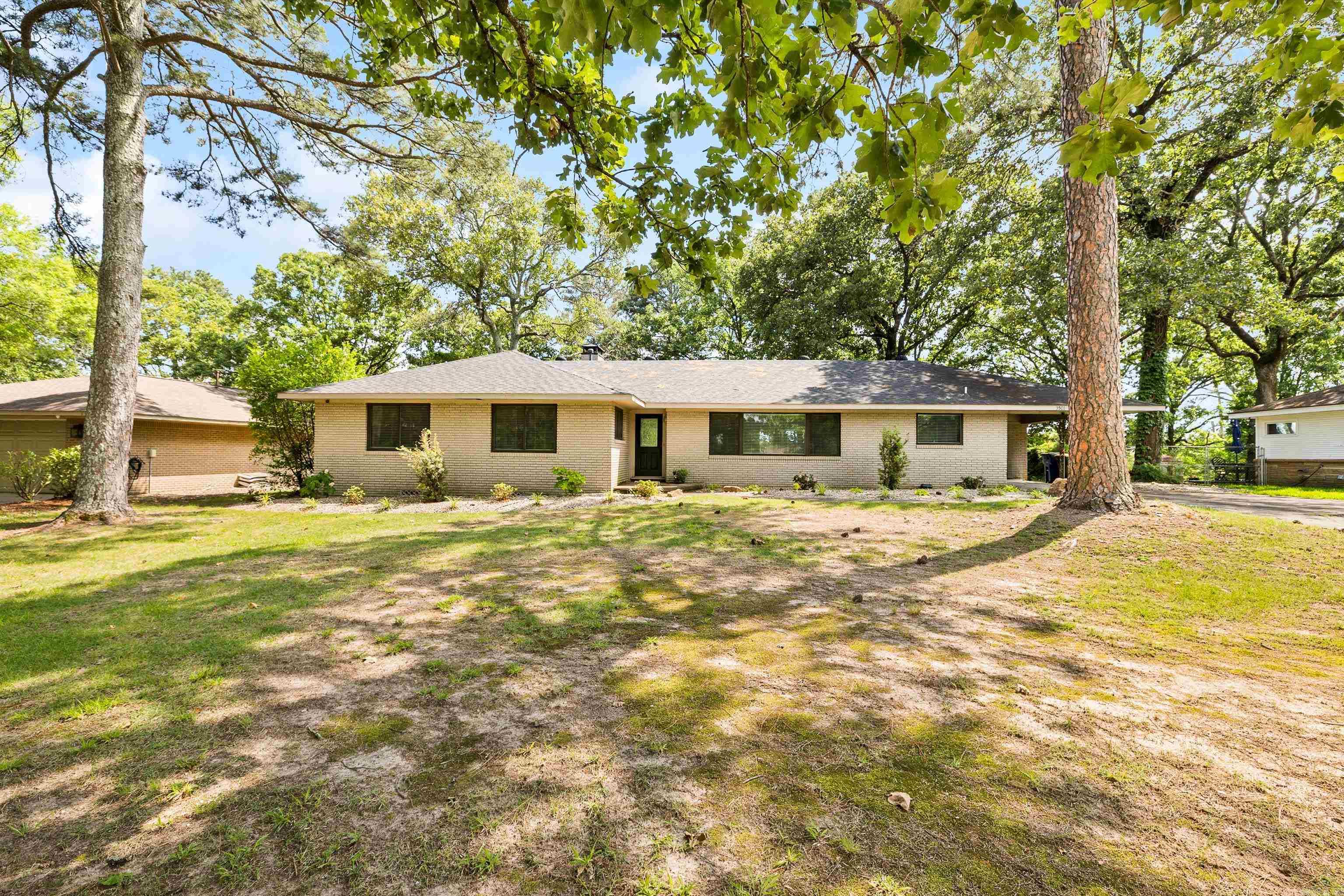 Tucked away on a beautiful wooded lakefront lot of nearly an acre, this recently updated 3-bedroom, 2-bath home offers the kind of setting that makes you want to slow down and stay awhile. From the moment you arrive, you'll be surrounded by mature trees, natural beauty, and a sense of privacy that's hard to find.  Inside, gorgeous wood floors and an open-concept layout create a warm, welcoming space that's perfect for gathering with family and friends. Natural light fills the home, while the flowing floor plan makes everyday living feel effortless.  Step outside and imagine morning coffee on the porch, evenings spent enjoying the peaceful surroundings, and weekends filled with endless possibilities. Whether you're dreaming of creating your own outdoor oasis, expanding the property, or simply enjoying the incredible lot as it is, this home provides a rare opportunity to make it your own.  Located in the highly desirable Park Hill area, you'll enjoy the perfect balance of peaceful living and convenience. Take advantage of nearby walking trails, outdoor recreation, and the charm of the historic Old Mill, just minutes away. With shopping, dining, parks, and schools close by, you'll lov