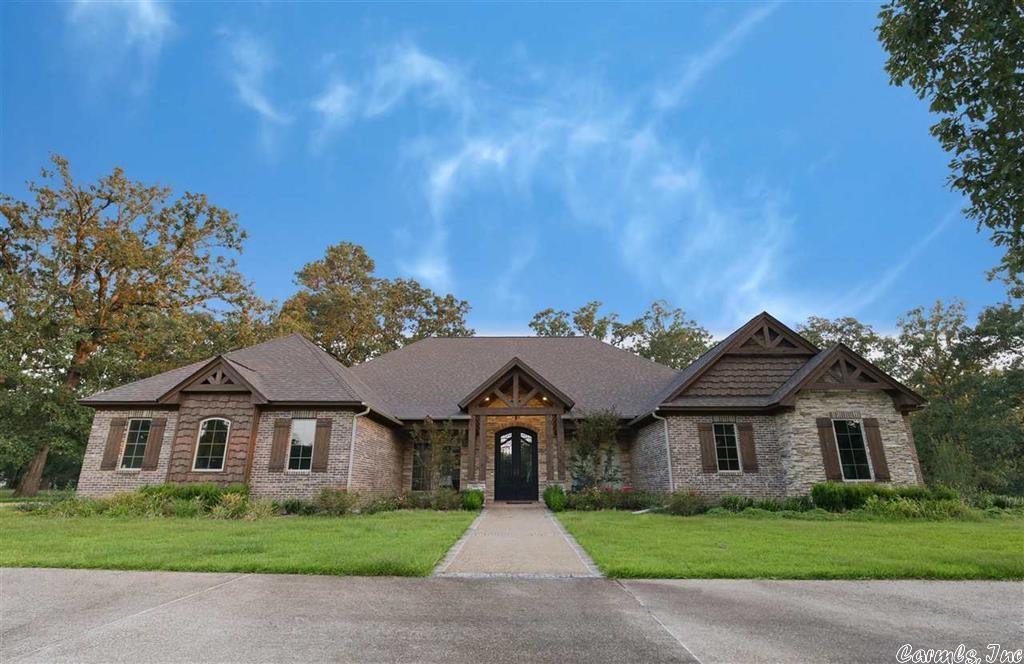 This exquisite estate in Texarkana, Arkansas is situated on seven acres and has everything you could possibly need for entertaining. The 4 bedrooms and 3 & 1/2 baths, along with the home's open floor plan offer plenty of space to suit all your needs. Enjoy gorgeous views of the pond from the sunroom or oversized patio. The 30x50 barn has tons of floor space upstairs as well as locked storage downstairs. Schedule your showing to see what more this home has to offer!