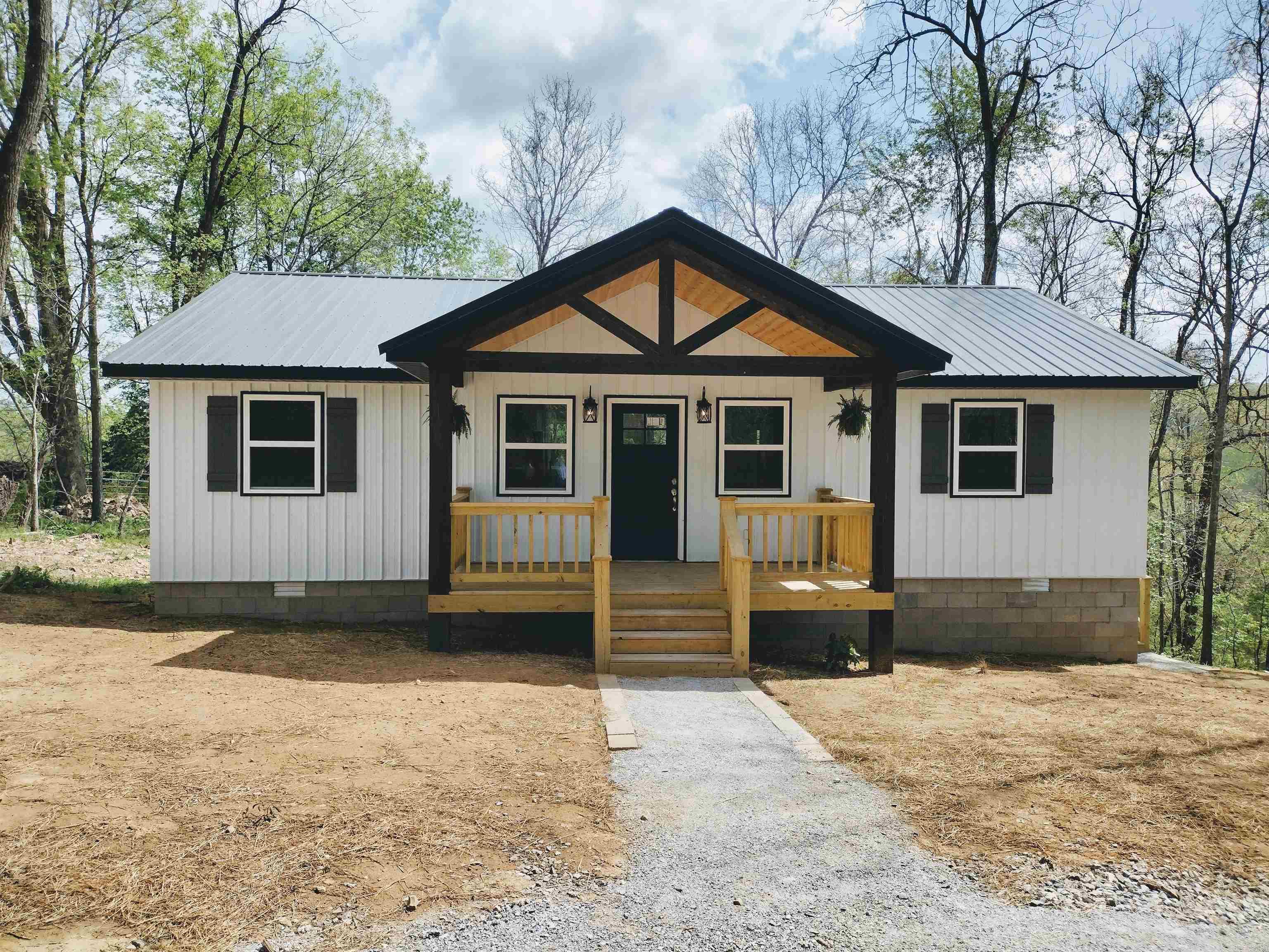 If you're searching for a well-built home with peace and privacy, this property is a must see! Situated on 3.97 acres M/L it offers beautiful mountain views and serene, private setting. This home features all- new appliances, including refrigerator, electric range, dishwasher, washer and dryer, making it move in ready.  Also has solid surface counter tops and custom build cabinets. Step out onto the spacious back deck and enjoy the stunning views and quiet surroundings, perfect for relaxing or entertaining. Additional highlights include a convenient circle drive and quality construction throughout. this property combines comfort functionality, and natural beauty ideal for those want a private home or getaway