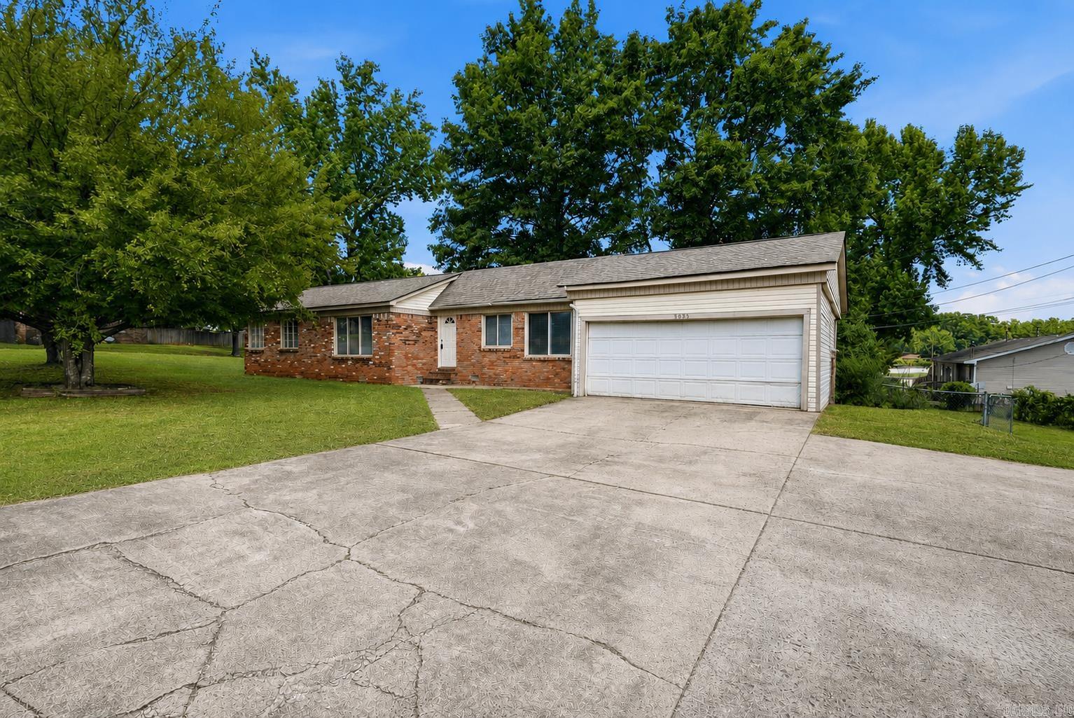 Move-in ready 3-bedroom, 2-bath home situated on a generous .39-acre corner lot. The split floor plan places the primary suite away from the secondary bedrooms for added privacy. Inside, you'll find a spacious living room, separate dining room, and a roomy kitchen with brand-new appliances and plenty of cabinet and counter space. Original hardwood floors run throughout much of the home, adding warmth and character, while the updated bathrooms and kitchen give the home a fresh, modern feel. A sliding glass door off the living room leads to the back deck overlooking the fully fenced backyard, creating a great space to relax or entertain. An attached two-car garage with a brand-new door and a roof that's only approx. four years old add to the home's appeal. Conveniently located just minutes from shopping, Dupree Park, major highway access, and only about 10 minutes from Little Rock Air Force Base, this home offers the space you need with a location that makes everyday life a little easier. *Select photos are virtually staged to show properties potential*