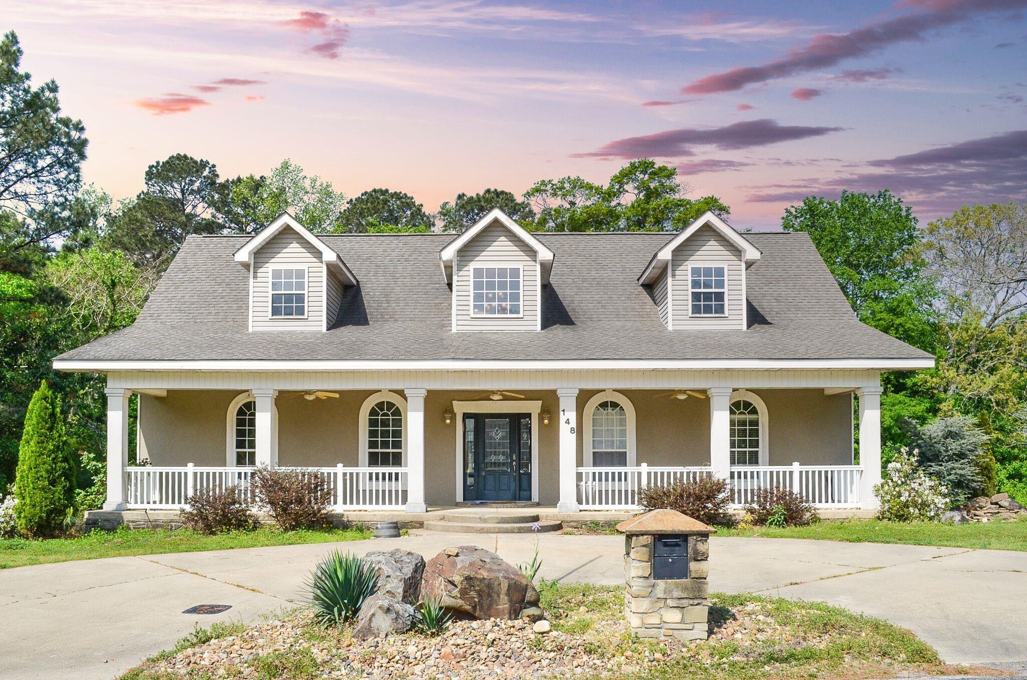 Spectacular layout on this 4 bedroom/4 bathroom 2 level home. There are 2 separate living areas as well as a Media Room. There are 2 bedrooms and 2 bathrooms on the main level. Tons of space to gather with family and friends. Highlight features of this home are high volume ceilings, granite, hardwood floors, lots of custom built-ins, gas log fireplace, gas range, large laundry room, covered back patio, fenced yard perfect for a pool with a gate for added privacy and a circle driveway! The oversized garage has enough space for your vehicles and room for a workshop. Solar Panels, Home Generator, High Eff Dual Fueled HVAC, Rinnai Tankless Water Heater, Low E Energy Eff Windows. Be sure to call today for your VIP showing! SEE AGENT REMARKS.