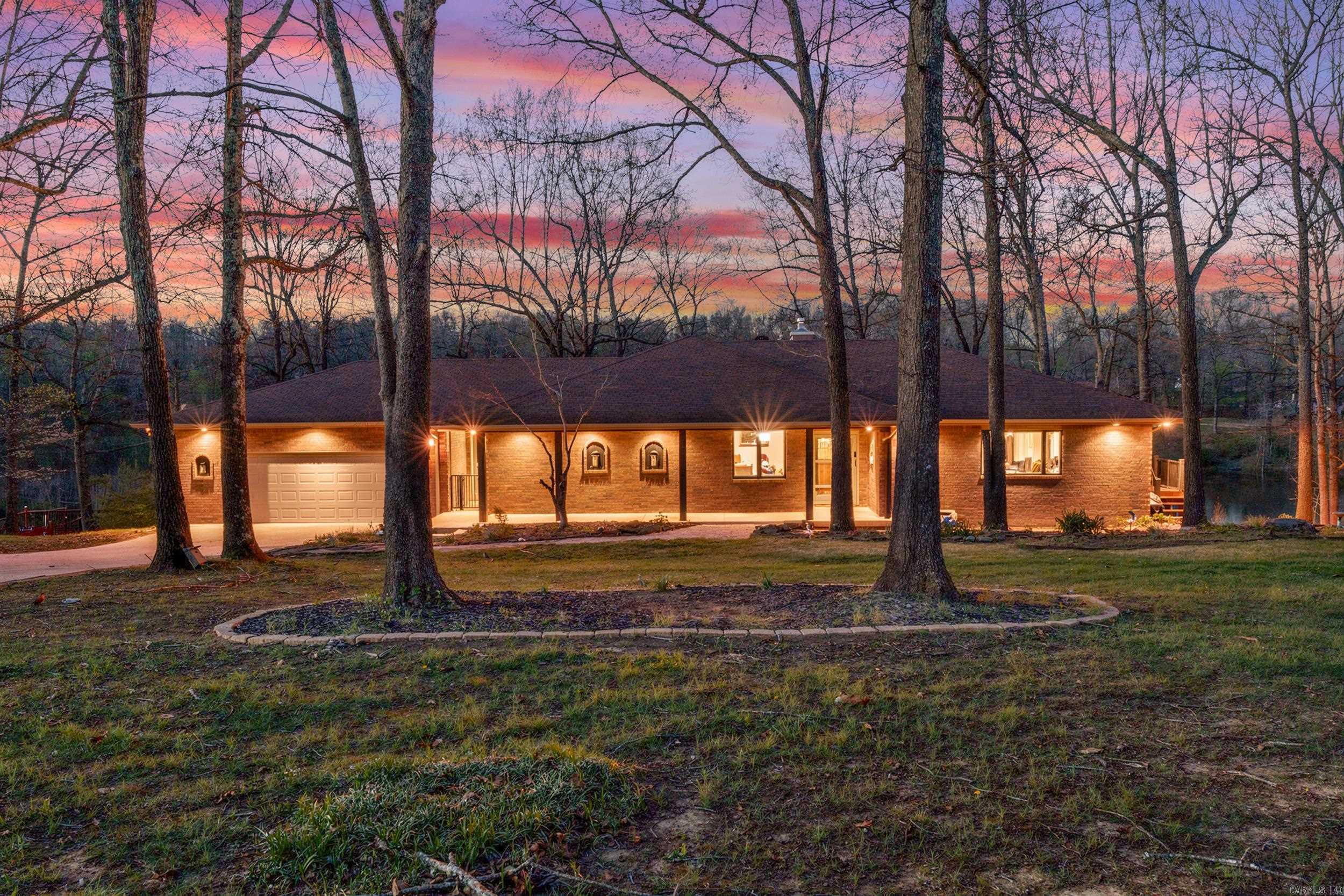 Enjoy peaceful lakefront living in this beautifully maintained 3-bedroom, 2-bath home overlooking Driftwood Lake in Mountain Home, Arkansas. Designed with an open floor plan and expansive windows, the main living area is filled with natural light and captures stunning water views from multiple angles. The kitchen is a true centerpiece, featuring granite countertops, stainless steel appliances, a gas stove, large pantry, and a dedicated coffee bar—perfect for both everyday living and entertaining. The spacious primary suite offers private deck access, creating the ideal spot to start or end your day while overlooking the lake, along with a walk-in shower for added comfort. Additional features include a generous utility/mud room, abundant storage, and a 2-car garage. Step outside to enjoy the back deck, ideal for relaxing or hosting. With great curb appeal and a serene setting, this property offers the perfect blend of comfort, functionality, and Ozark charm.