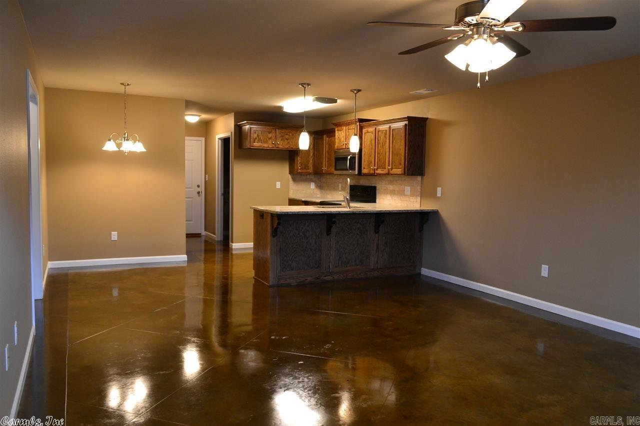 Craftsman style duplex built in 2015 that's close to everything in Benton plus easy access to I-30!  Walking dist to Wal-mart, McDonalds, Kroger and more.  Stained concrete floors, granite countertops, new appliances, upgraded lighting fixtures, open layout, master bedroom with full bath, sep laundry room with pantry, outside storage, cute covered front porch and private fenced backyard in a quiet area.