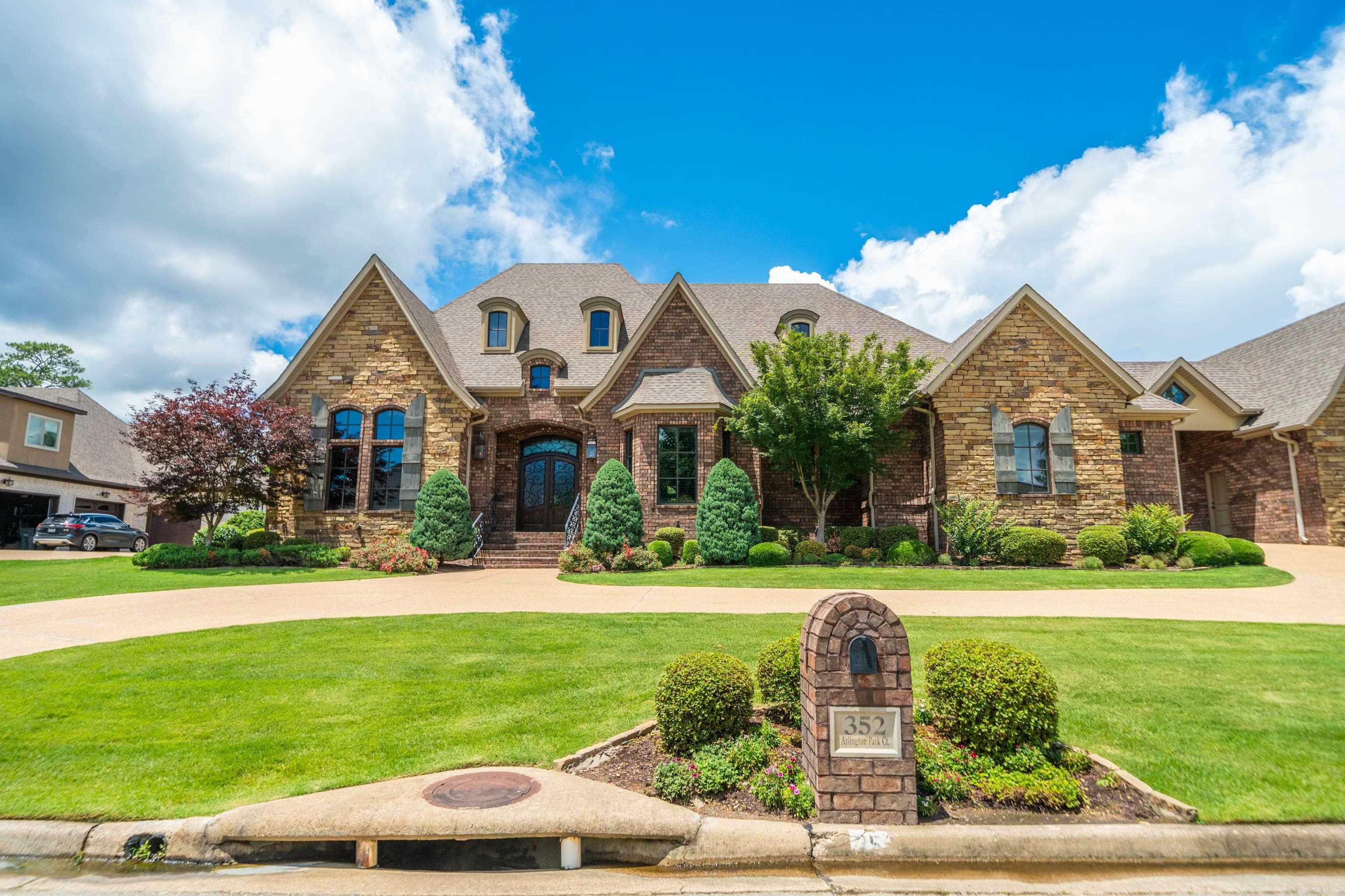 Rare opportunity in the highly sought-after gated community of Arlington Park! This stunning golf course-front home offers 5 bedrooms, 4.5 bathrooms, and an exceptional blend of luxury, comfort, and craftsmanship. Designed with both everyday living and entertaining in mind, the spacious floor plan features two large kitchen islands, custom woodwork throughout, and high-end finishes that showcase the home’s quality and attention to detail. The chef’s kitchen flows seamlessly into the living and dining areas, creating the perfect gathering space for family and friends. The luxurious primary suite is a true retreat, complete with a convenient laundry room located directly off the master closet. A second laundry room provides added functionality for busy households. Step outside to your private backyard oasis featuring a large swimming pool, relaxing hot tub, and beautiful golf course views. Additional upgrades include high-end electric window treatments, a whole-home Generac generator, and a spacious four-car garage with ample room for vehicles, storage, and hobbies. Located in the prestigious gated neighborhood of Arlington Park, this one-of-a-kind property offers luxury living, exce