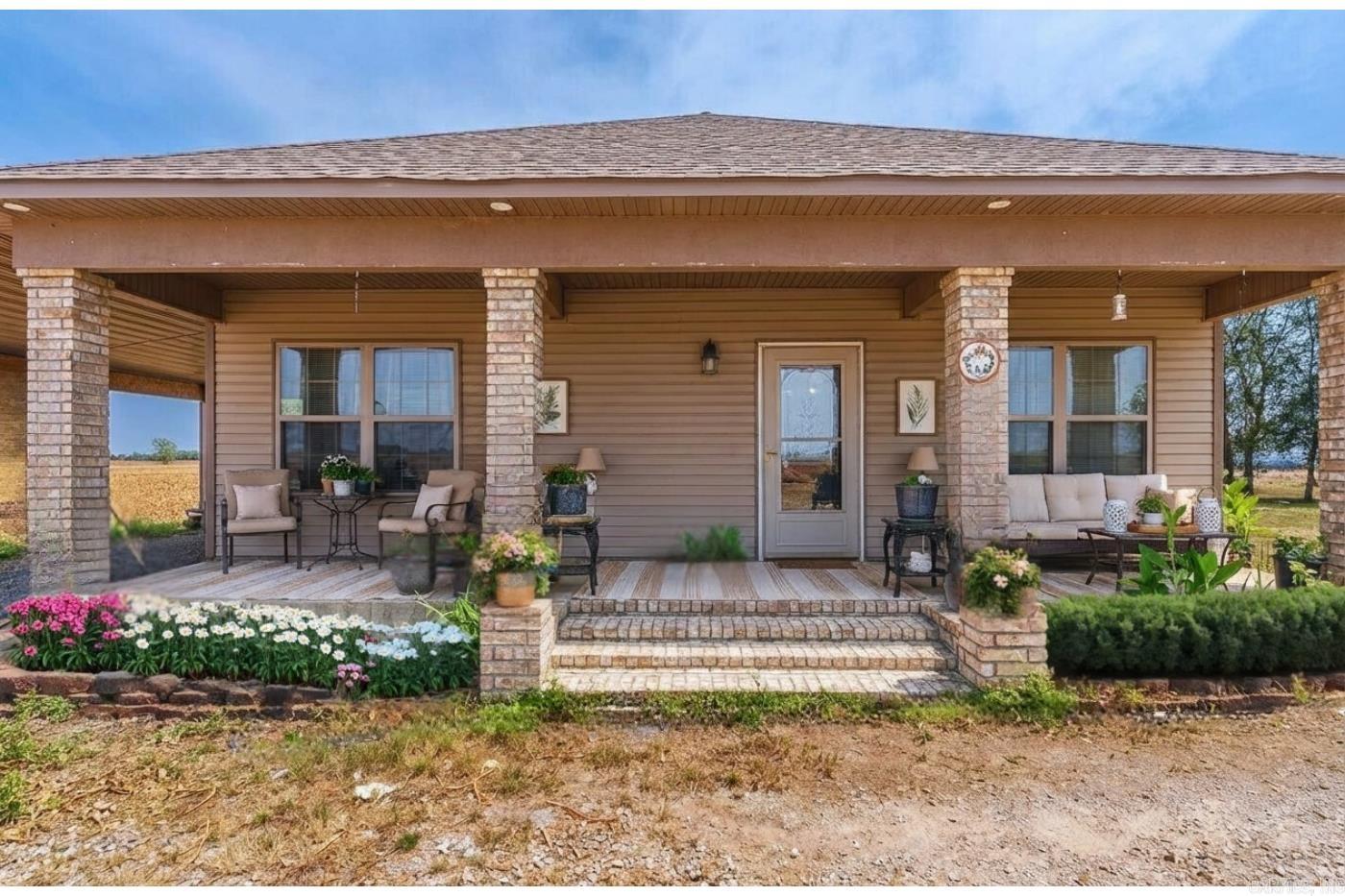 A wonderful opportunity to own two homes on approximately 1 acre +/-, each with its own utilities and the comfort of private living.  It is hard to find two residences this close together, and this unique setup provides incredible flexibility for multi-generational living, rental income, or extended family arrangements.  The Bungalow, built in 2018, features 2 bedrooms and 2 bathrooms with a spacious open-concept living and dining area highlighted by gorgeous wood beams and tall ceilings.  The kitchen offers stunning cabinetry, a gas cooktop, and a built-in wall oven.  A large walk-in closet and dedicated laundry room add to the functionality of this thoughtfully designed home. The Farmhouse offers 2 bedrooms with the potential for a third bedroom and 1 bathroom.  The remodeled interior includes a recently updated bathroom with a walk-in shower.  The kitchen features a gas top stove, beautiful vent-a-hood, and ample space for gathering and entertaining.  A utility room sits just off the side of the home, leading to a deck that is perfect for summer BBQs. The roof and HVAC system are approximately 3 years old.  Call or text today.  Some pictures are virtually staged.