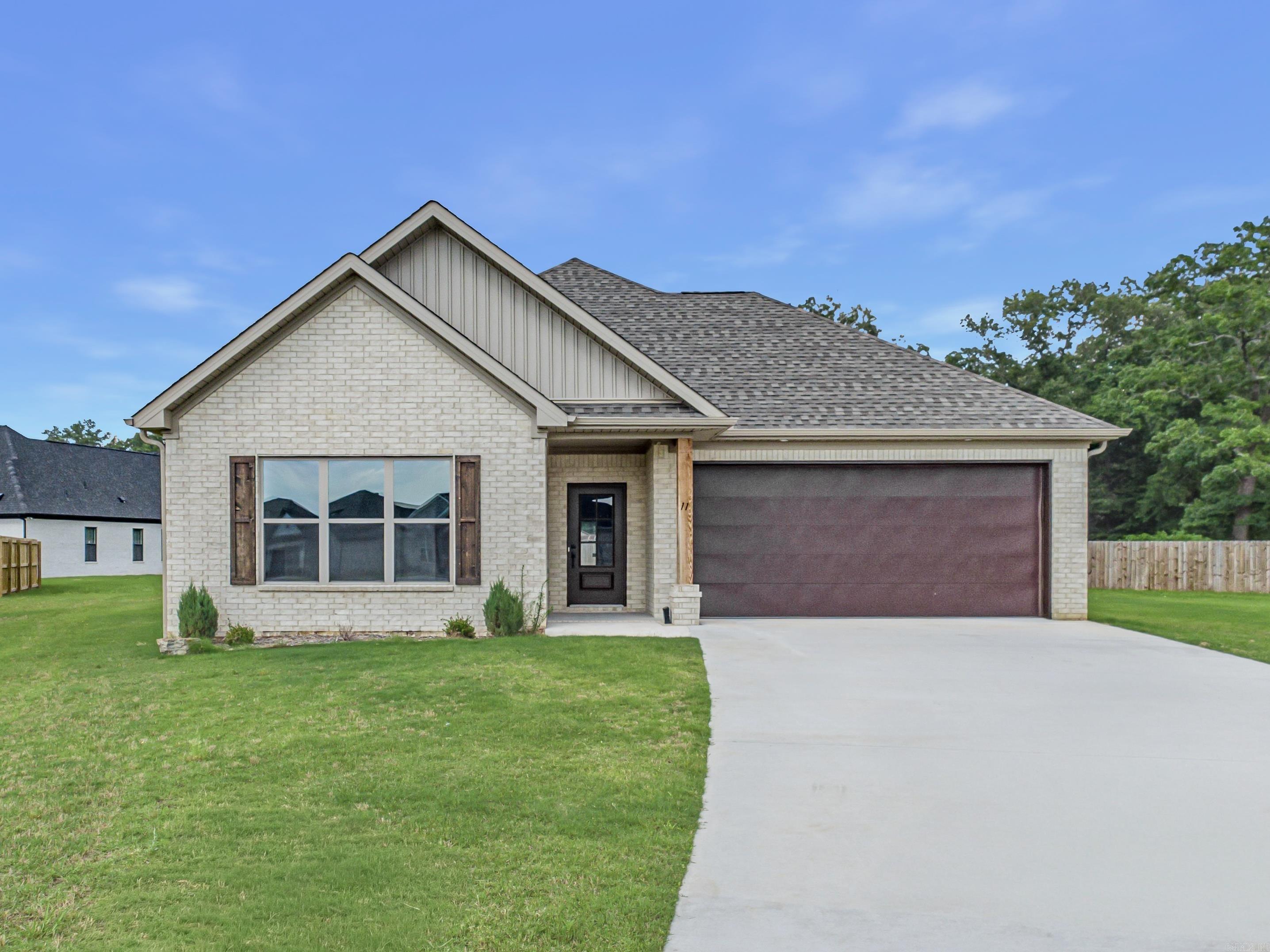 This NEW CONSTRUCTION and beautifully appointed 3 bed, 2 bath home blends style and comfort with an open layout. Tall ceilings, beautiful trim work lvp throughout and a STUNNING statement fireplace. The kitchen shines with quartz countertops, pantry, ss appliances and modern appeal, The primary bath includes a gorgeous tile shower, vessel tub and so much more. Enjoy mornings on the back porch and evenings in the large backyard—perfect for making memories. This is a must see. ** See remarks**