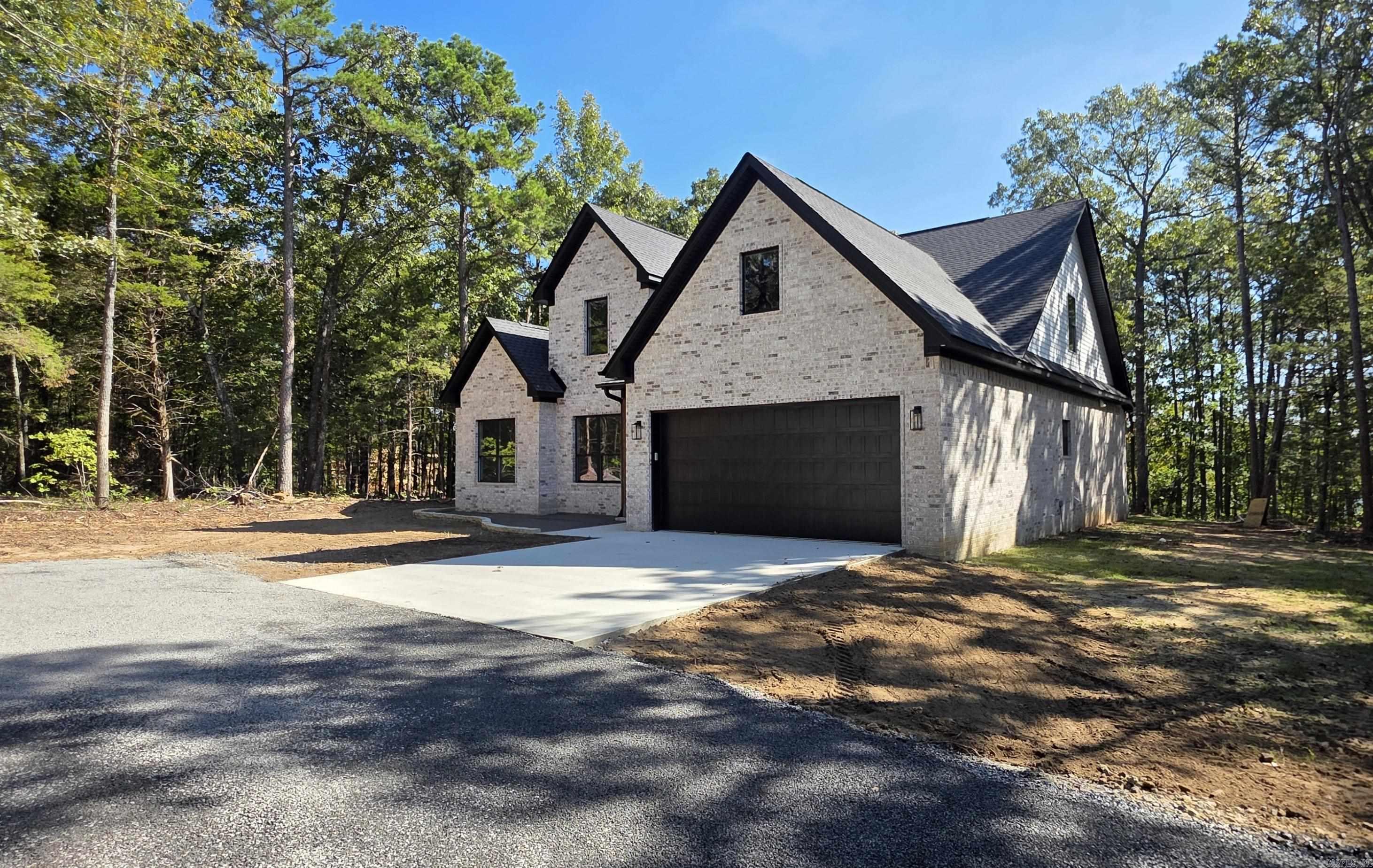 BRAND NEW LAKEFRONT HOME WITH 2-SLIP DOCK located directly behind the house!  5-bedrooms, 4-baths, 2 living areas, very large covered back patio, great lake views, wood-burning fireplace, gated subdivision, great cove for swimming and much more!  Taxes and Subdivision fee are not yet determined.  Don't miss this opportunity for a NEW HOME and a NEW DOCK!!!  See photos for:  plans and specs, great aerial pics, dock pictures, gated entry and more!  Seller will credit the buyer $3,000.00 at closing for a sod allowance.