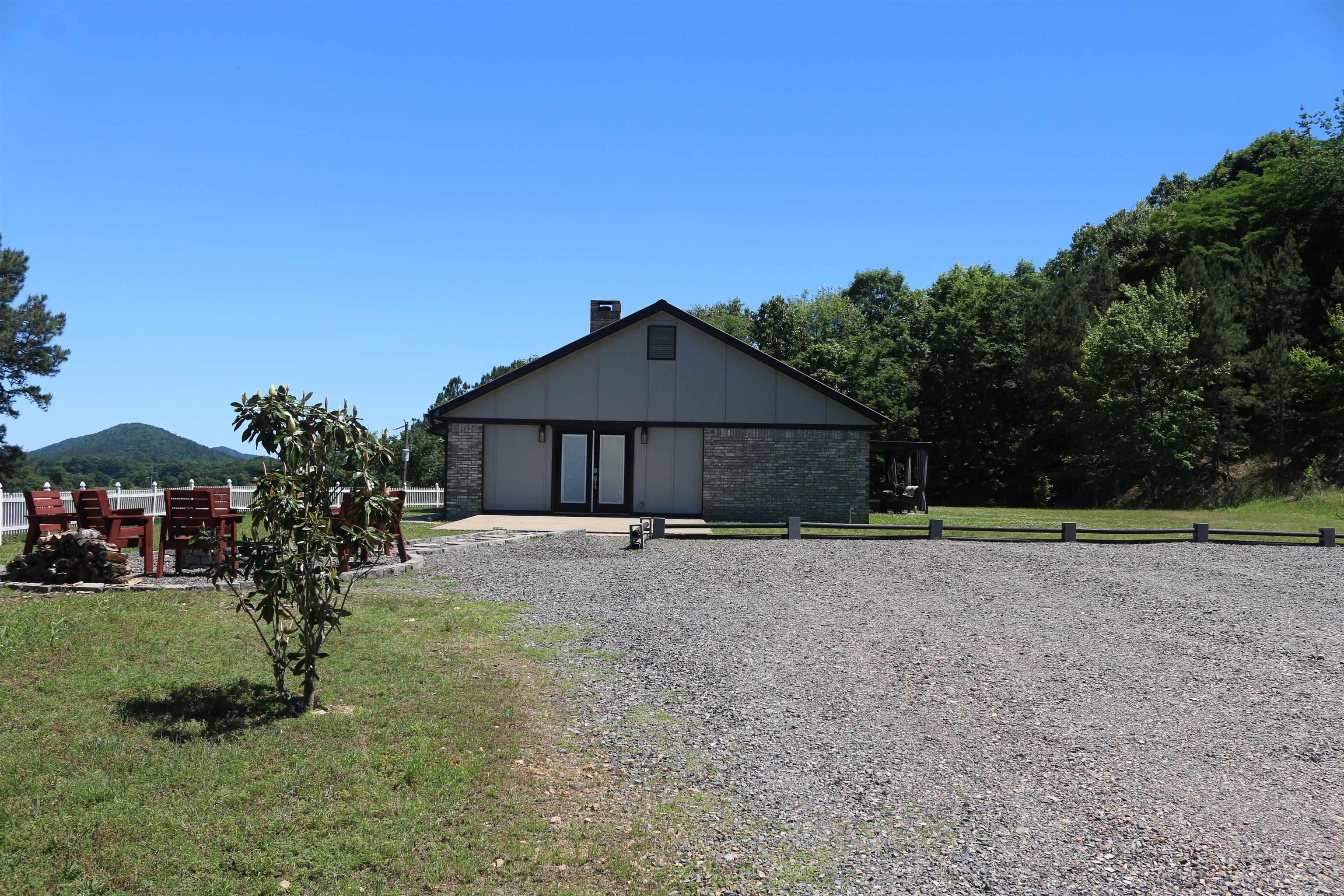 This 34+/- acres is one for the books! This complete newly remodeled 3 bed, 2 bath brick home is up for grabs, don't miss out on this one! The remarkable mountain views that this property boasts from the front porch of this home will definitely grab hold of you and not let you go. The sunrises here are something else. Roughly 20 acres is fenced and has some amazing native grasses for your horses or your cattle. With 2 ponds on the property water is no issue and neither is the fish! The backside of the house is made up of great hardwood/pine mix that holds some great wildlife.The quiet, quaint setting this house gives off is perfect for anyone looking to start a family or retire in the area. The open beam style ceiling in the living room with the wood burning fireplace sets that perfect setting for the cool mornings/evenings. The butcher block-stained counter tops throughout the house make for the perfect amount of wood in each bathroom and the kitchen. The generac system allowing for no power outages when that bad weather hits. With an older shop and big barn down the hill from the house, it is already set up for the farmer/rancher looking for their start. Let's go tour this one!