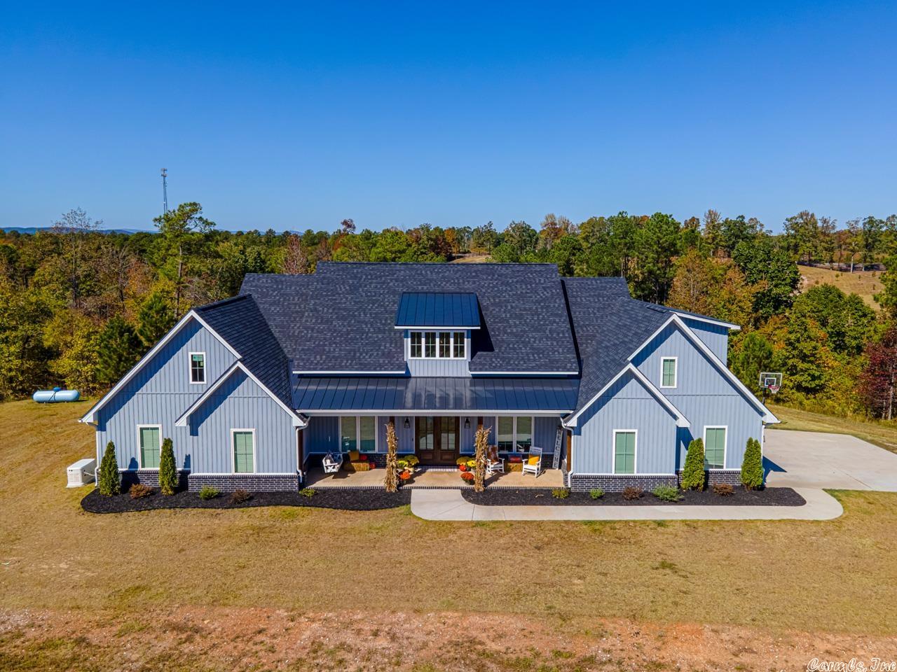 This beauty sits on over ten acres and offers five BR, three and a half BA plus a bonus and executive office. Stunning open plan that includes a top of the line chef's kitchen with double ovens, five burner gas cooktop and a double frig. Amazing primary suite with an unbelievable bath and closet that opens to laundry.  Second master suite available in this split floor plan. Spend your evenings watching breathtaking sunsets! An additional 3 acres can be purchased MLS# 22033805.