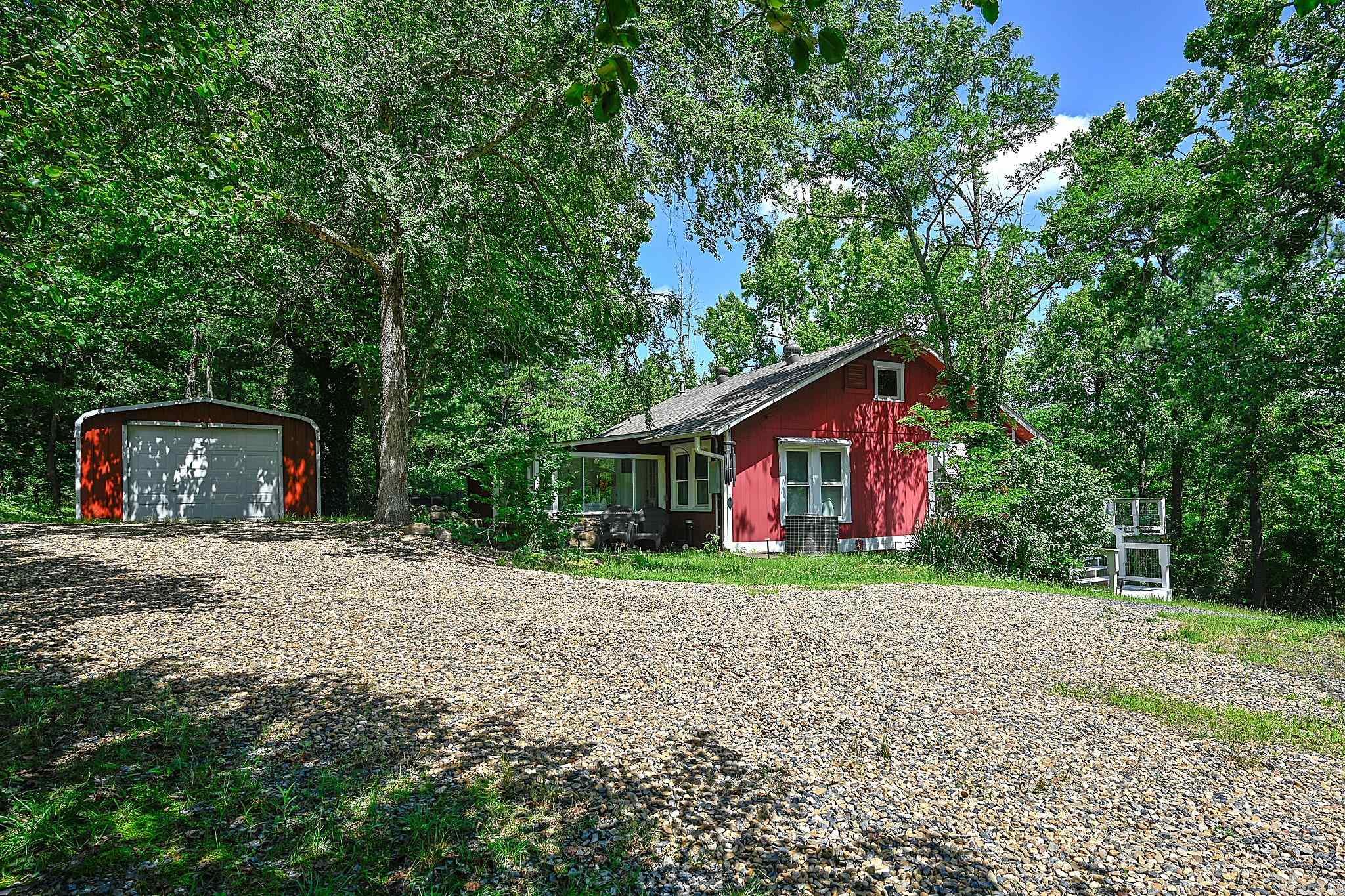 Escape to the beauty of the Ouachita Mountains! This charming mountain-view retreat offers the freedom of no restrictions only 6 miles outside of Mena city limits. Property is less than 1,000 feet from the Ouachita National Forest, under 5 miles from Queen Wilhelmina State Park, and 9 miles from the Oklahoma state line. Whether you enjoy hiking, ATV riding, wildlife watching, or simply soaking in the mountain scenery, adventure is right outside your door. The home has been updated with electrical, plumbing, flooring, and fresh paint throughout. The spacious kitchen features beautiful sage green cabinetry and plenty of room for gathering with family and friends. Additional improvements include a new well pump, pipe & sand filtration system. Previously used as a short-term rental. This property offers excellent potential as a primary residence, mountain getaway, or investment opportunity. Furnishings are negotiable!