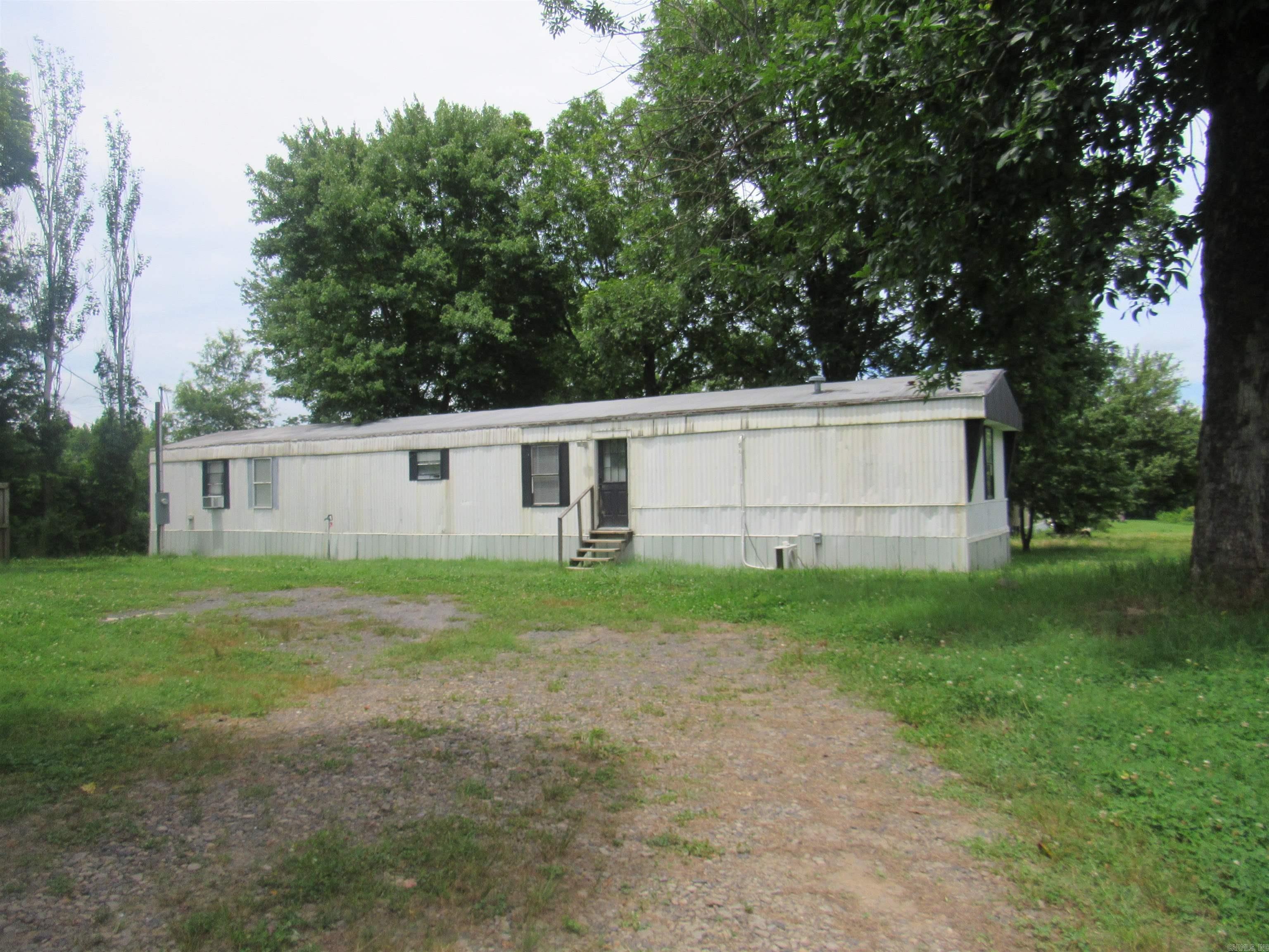 Charming updated 3-bedroom, 2-bathroom home sitting on a spacious 0.5-acre corner lot in Vilonia! This property is packed with custom updates, including beautiful modern flooring, updated light fixtures, and custom trimmed-out windows. Enjoy maximum energy efficiency and personalized comfort with three brand-new ductless mini-split heating and air systems.  The interior features a gorgeous inlet bay window perfect for a reading nook or extra storage, a dedicated laundry space, and a kitchen equipped with a refrigerator. The guest bathroom boasts a beautiful, custom tile shower. Outside, the large corner lot offers plenty of space and includes a handy storage shed. All-electric utilities and cost-saving well water. This turnkey rental property won't last long—schedule your showing and request an application today!
