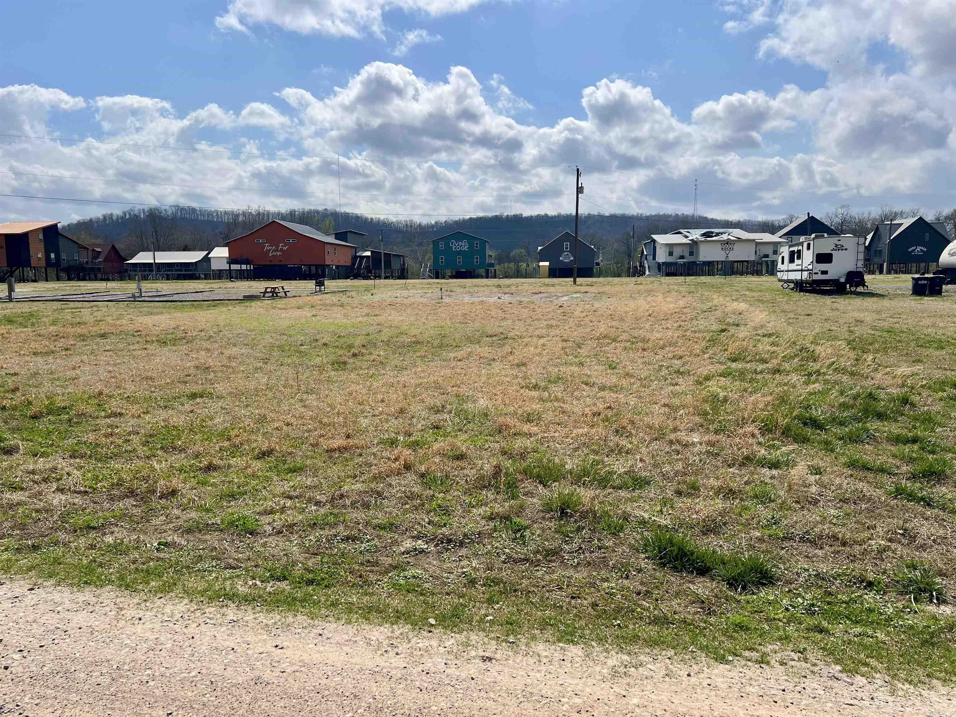 Lot on Serenity Loop featuring 0.30 acre+/- with water and sewer already in place. Perfect spot to park your camper or build a cozy tiny home. Enjoy ease access to the beautiful Caddo River, making it a great getaway or investment opportunity.