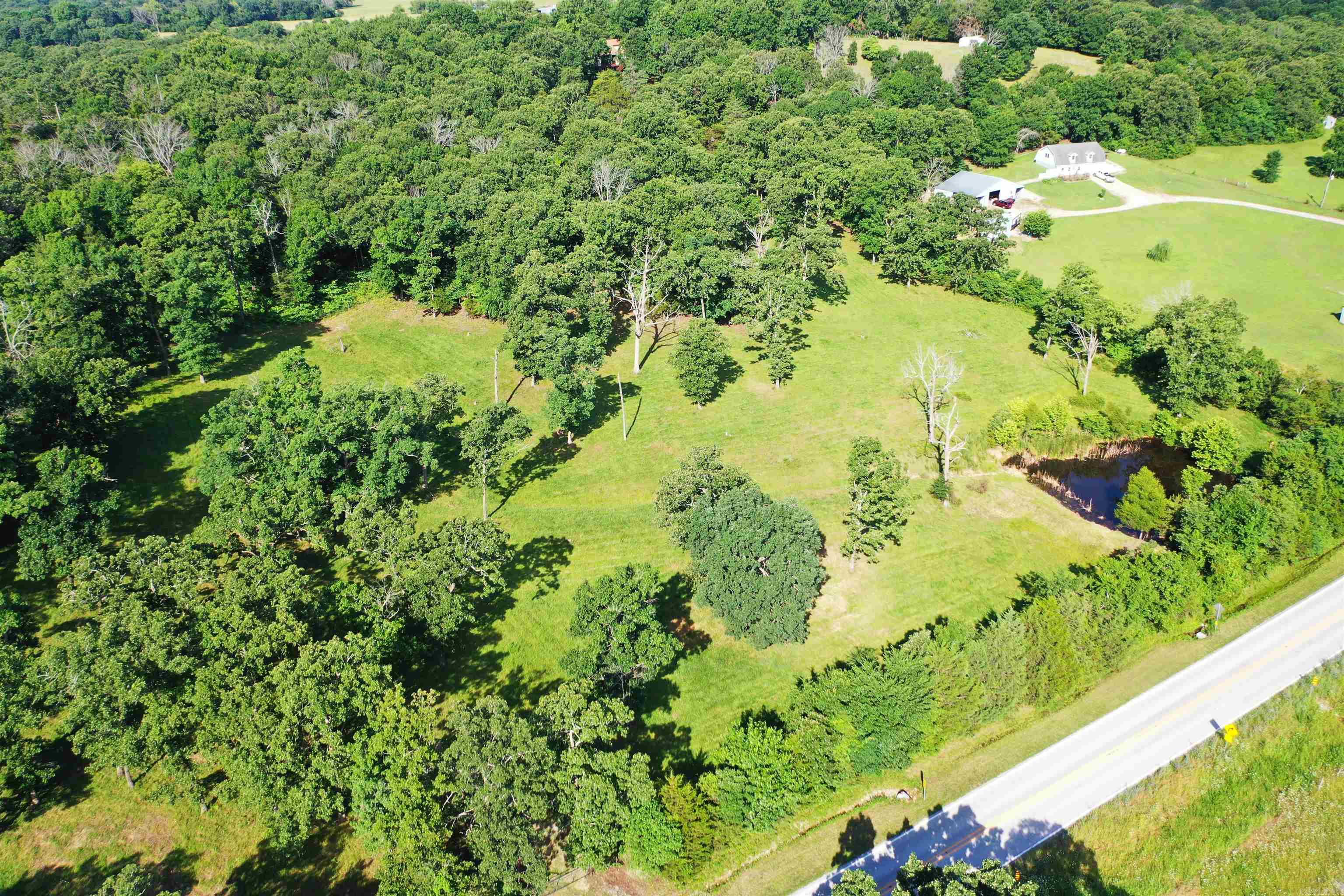 Discover a rare opportunity to own a versatile 9.20 acres M/L tract of land offering both unrestricted acreage—perfect for flexible building and recreational use—and restricted acreage designed to protect long-term property values. This unique combination provides the freedom you want with the stability buyers appreciate. Located in a peaceful rural setting with easy access to Mountain Home and White River just 4 miles away. It also has a beautiful spring-fed pond providing a reliable, water source year-round. Most of the property is fenced and cross-fenced.