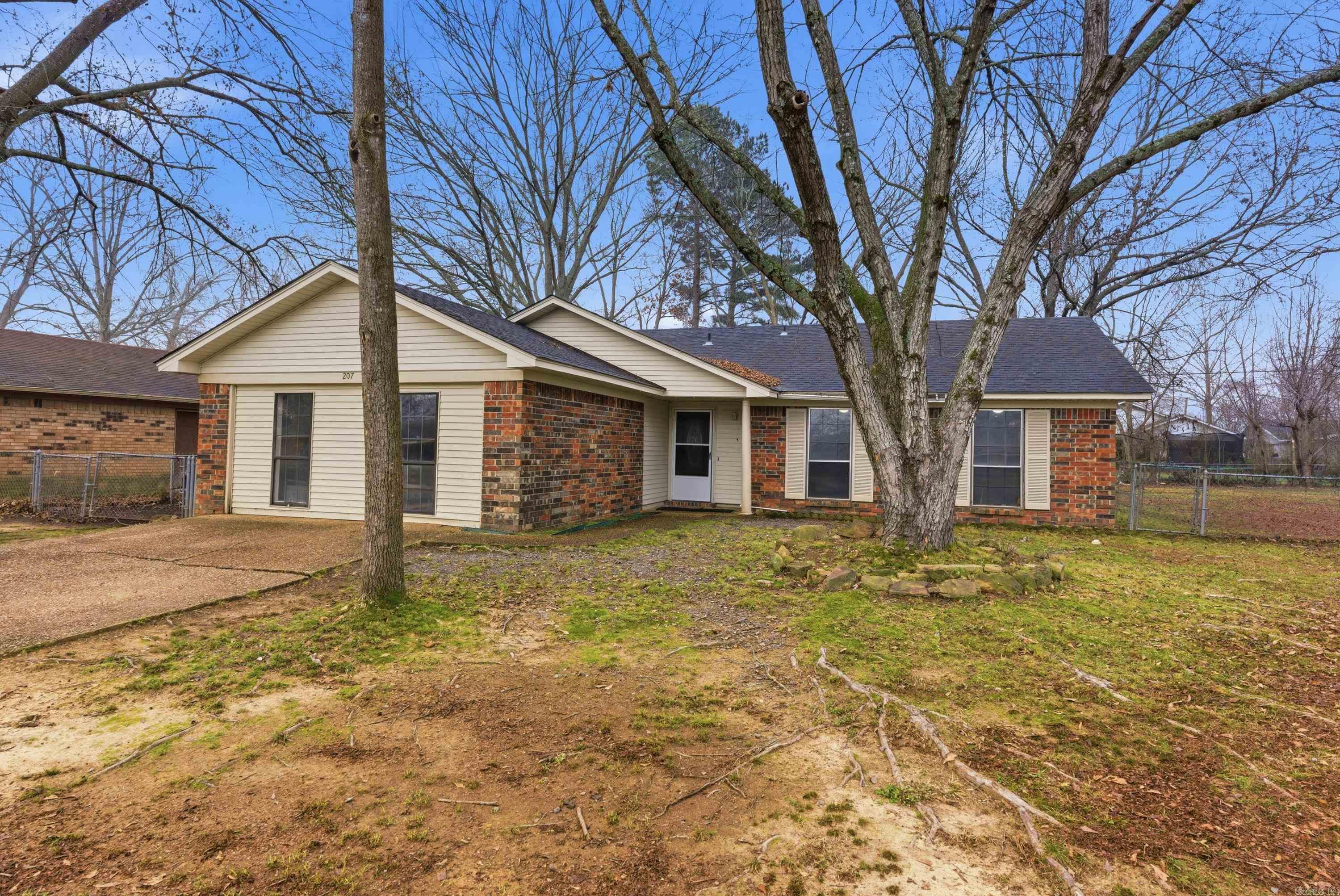 4 bedroom, 2 bathroom home located in an established Conway neighborhood featuring tile flooring throughout and a functional layout. The spacious living area offers great natural light and double doors leading to the covered back patio. The kitchen provides ample cabinet space, tile countertops, tiled backsplash, and a mix of appliances, with a dining area nearby. Situated on a very spacious lot with mature trees and a storage building that conveys. Just minutes from schools, UCA, and shopping. Agents see remarks.