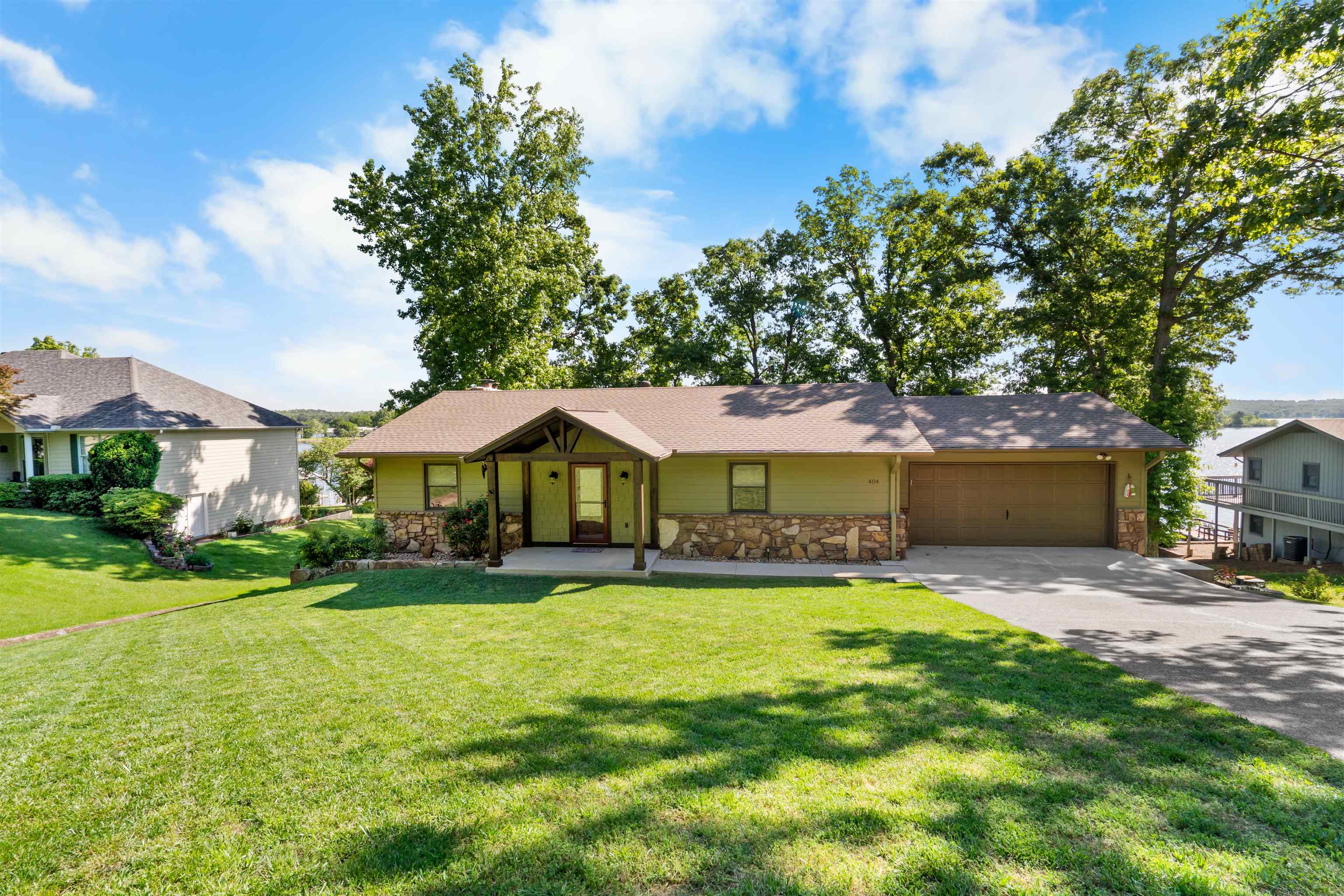 Beautiful, well maintained lakefront home offering the perfect blend of comfort, space, and scenic views! The home has been completely updated inside & out along with a NEW Central heating/air system installed March 2026. This 3 bedroom, 2 bathroom home features an inviting open floor plan on the main level, with a wood-burning fireplace. The kitchen has custom cabinetry with granite countertops, stainless steel appliances, and a pantry. The main floor also includes two spacious bedrooms with a full bathroom between for easy access. Downstairs, the walk-out basement provides additional living space with a second living area, a third bedroom, and a full bathroom. Step outside and enjoy lake living at its best with decks on both levels, perfect for entertaining or soaking in the views. With easy access down to the water, this property is ready for you to enjoy everything lake life has to offer.