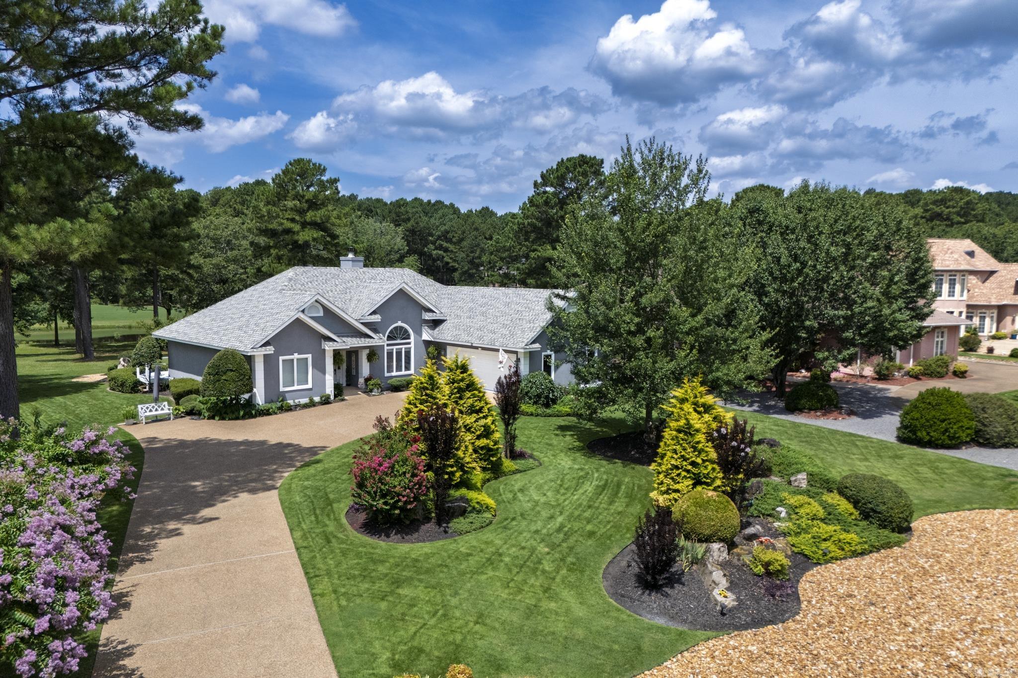 Enjoy resort-style living in this beautifully updated one-level home overlooking the DIAMANTE GOLF COURSE. Featuring an open floor plan with vaulted ceilings, large windows and a cozy gas fireplace, this home blends comfort and style. The kitchen boasts granite countertops, an island and stainless appliances. The spacious primary suite includes a walk-in closet and spa-inspired bath. Relax on the back patio with serene views of the pond and 17th green, surrounded by lush landscaping. DIAMANTE dues include unlimited golf on the private Diamante golf course. Diamante subdivision & country club is home to Golf Digest #4 ranked AR golf course. Club amenities include world class tennis & pickleball, a private swimming pool & a wide array of dining & social events. Property owners receive 3 free rounds of golf each month for family & friends. HSV is America’s largest gated community encompassing 26,000 acres, over 30 miles of walking trails, 9 golf courses and 11 lakes for fishing & boating. HSV is 15 miles from historic Hot Springs National Park and Oaklawn Racing Casino Resort. Move-in ready and perfectly maintained -- a true Hot Springs Village gem.