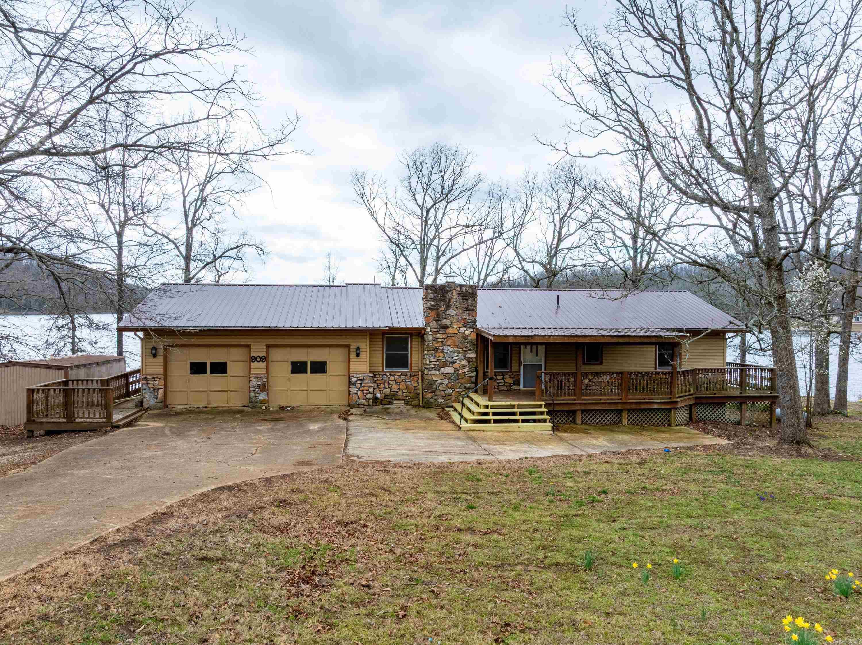 Lakefront home on Diamond Lake in Horseshoe Bend, Deck across entire back of house, screened in back porch, 2 bedrooms, 2 bathrooms, large living room, dining room, kitchen, laundry and walk out into attached garage all on main level. Basement has a half bath, doors leading out to a patio area, room for a bed and living area. All heated and cooled.Dock for pontoon and a boat with lift, both will stay. Metal roof, sheds, Agent owned.