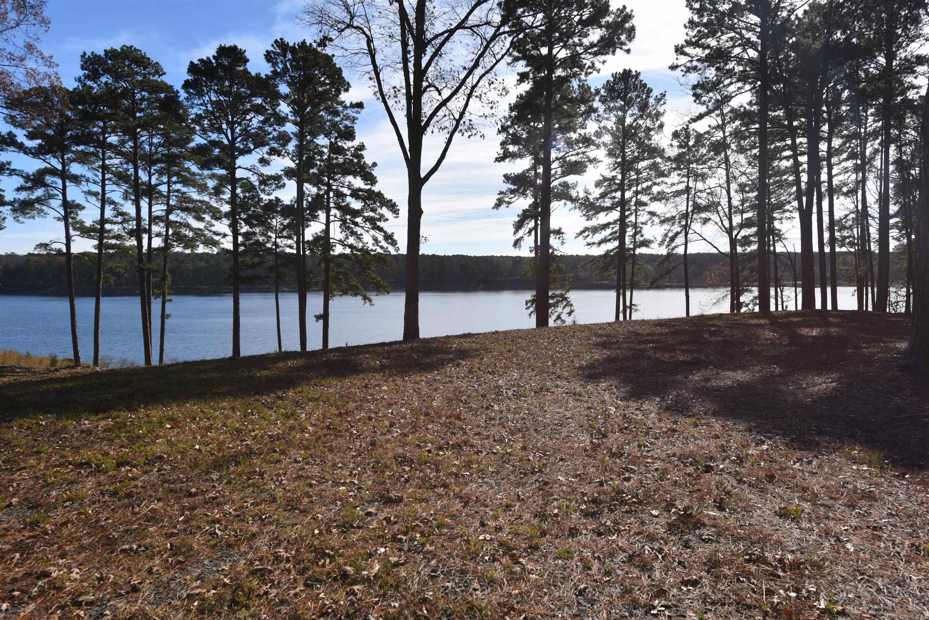 Don’t miss this rare opportunity to own a premium lakefront lot in the prestigious Grand Isle subdivision of Fairfield Bay! A boat slip nearby is availalbe to purchase for $35,000. This beautifully cleared lot is ready for your dream home—imagine waking each morning to breathtaking water views & enjoying the peace & privacy this unmatched location offers. Perfectly positioned with a low white line to maximize your gorgeous, unobstructed lake views. Ready to Build: Cleared & primed to begin construction on your custom home. No vacation rentals permitted, ensuring a peaceful, residential neighborhood. Underground Utilities: Seamless, modern infrastructure for power & fiber internet.  Enjoy All Fairfield Bay Has to Offer: Championship Golf: Two 18-hole courses just minutes away. Active Lifestyle: Pickleball, tennis courts, and more than 80 miles of ATV/UTV trails. Full-Service Marina, Swim, hike, bike, & so much more. Fairfield Bay truly is a slice of paradise! Build your forever home or a serene getaway in a welcoming, upscale neighborhood. This is your chance to experience lakefront living at its finest—where tranquility & recreation meet luxury and convenience. Paradise is calling.