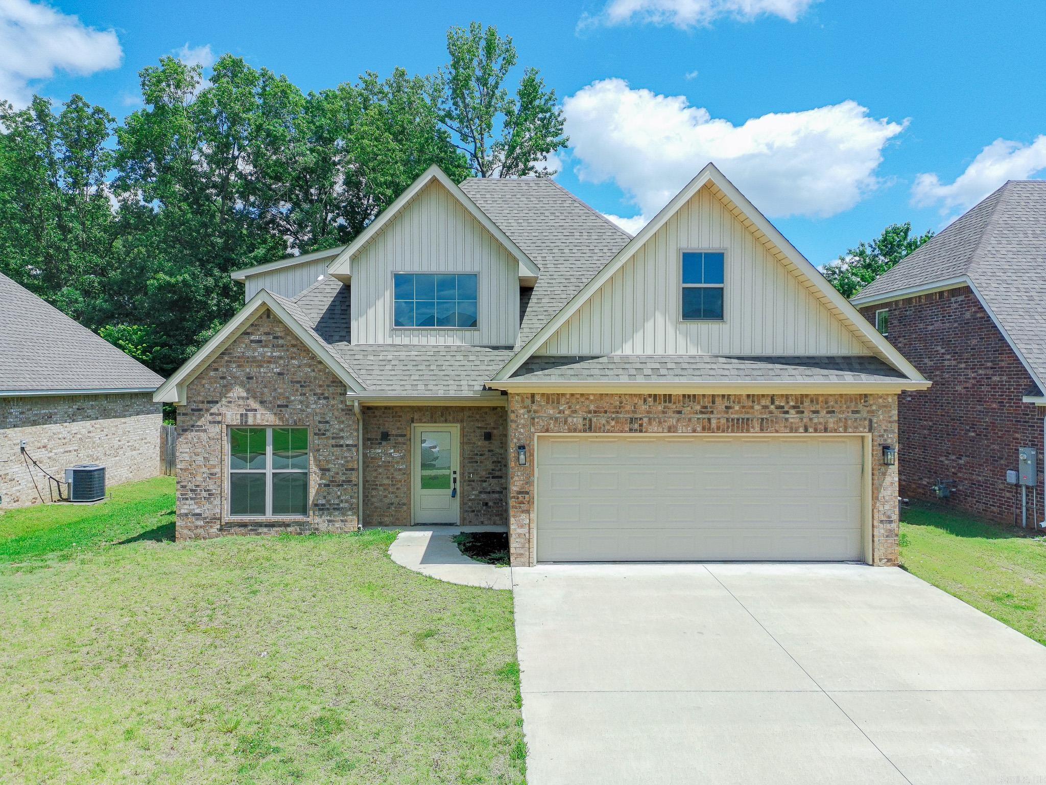 Spacious and beautifully appointed 5-bedroom, 3-bath home in the desirable Hilltop area! This thoughtfully designed floor plan offers 2 bedrooms & 2 full baths on the main level, with 3 additional bedrooms, & a full bath upstairs, providing flexibility for families, guests, or a home office. The kitchen is a true centerpiece, featuring granite countertops, stainless steel appliances, breakfast bar, & plenty of workspace for cooking & entertaining. Durable luxury vinyl plank (LVP) flooring flows throughout the main living areas, while the cozy fireplace creates a warm & inviting atmosphere. Retreat to the spacious primary suite showcasing a tray ceiling, walk-in closet, dual sinks, relaxing soaker tub, & a beautifully tiled walk-in shower. Step outside to enjoy the covered back porch overlooking the privacy-fenced backyard—perfect for outdoor gatherings, pets, or simply unwinding after a long day. Additional features include a 2 car garage & an excellent location just minutes from Arkansas State University, NEA Baptist Hospital, shopping, dining, & everyday conveniences. With generous living space, modern finishes, & a prime location, this home offers everything you've been wanting!
