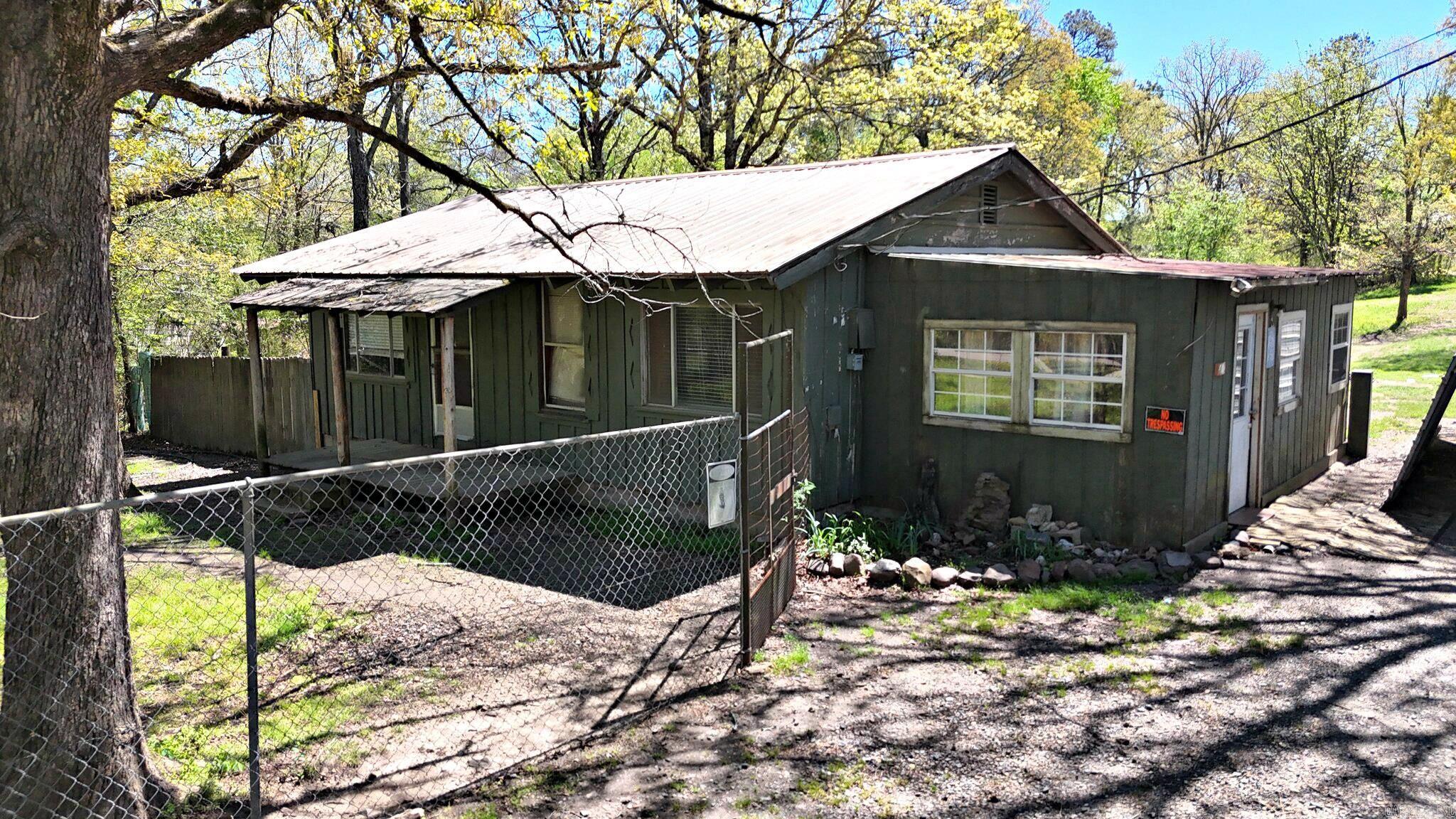 2-bedroom, 1-bath home of approximately 1,008 square feet on about 2.5 acres just outside Mena, Arkansas, offering a true fixer opportunity with room to create your own vision. The land feels open and usable, with space that may allow for additional homes or mobile homes to be placed, moved onto, or built for extra income or multigenerational living. On-site features reportedly include a large Conex-style storage container with power, an existing well that will need a pump and buyer inspection, and an additional water meter off Morgan Lane where it crosses the property, which may provide a future water source for added structures. If you have been looking for Mena, AR investment property, a small acreage project, or a place you can update and make your own, this one may meet your requirements.