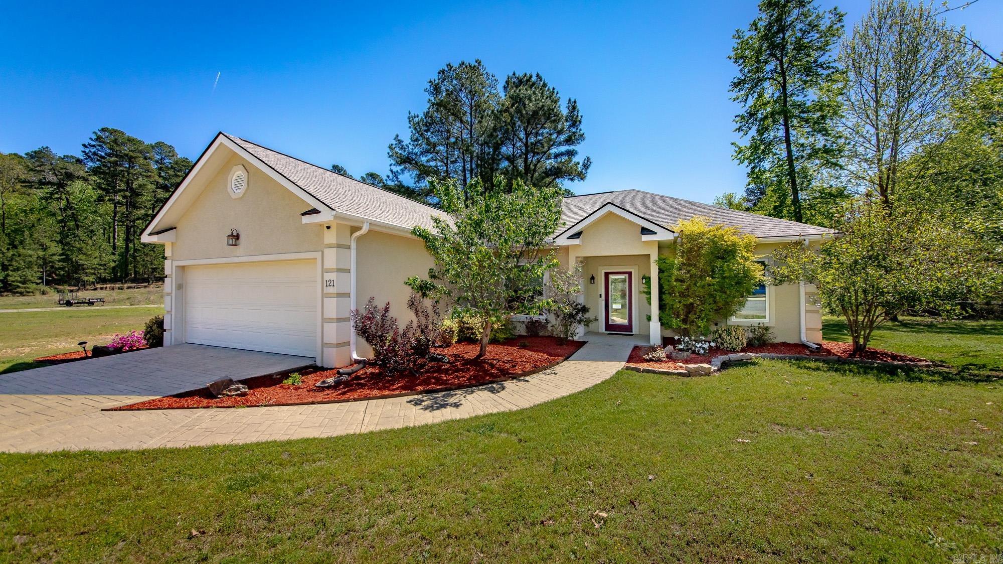 Live the Diamondhead lifestyle at 121 Blue Moon Terrace—a 3 bed / 2 bath, 1,918± SF corner-lot home built in 2010 with the space, finishes, and amenities today’s buyers search for. 1 year Home Warranty included for extra peace of mind. Inside: airy vaulted ceilings, a granite kitchen, and an attached 2-car garage with built-in loft storage. A flexible bonus room adapts to your life—and a new electric fireplace adds year-round comfort. Outside: a fresh pergola creates a private spot for morning coffee or evening gatherings. Community: Diamondhead’s resort amenities—golf, clubhouse, tennis and pickleball, Olympic-size pool, marina, and trails—are right here. Location: within Lakeside School District, about 2 miles to Lake Catherine State Park, and an easy drive to Hot Springs dining, shopping, and historic bathhouses in the Ouachita foothills.Key features buyers love: vaulted ceilings, granite counters, flex room, garage loft storage, new electric fireplace, pergola, all-electric utilities, public water/sewer, and community recreation at your doorstep. If you’re seeking move-in comfort plus a true lifestyle neighborhood, this is the one. Schedule your private showing.