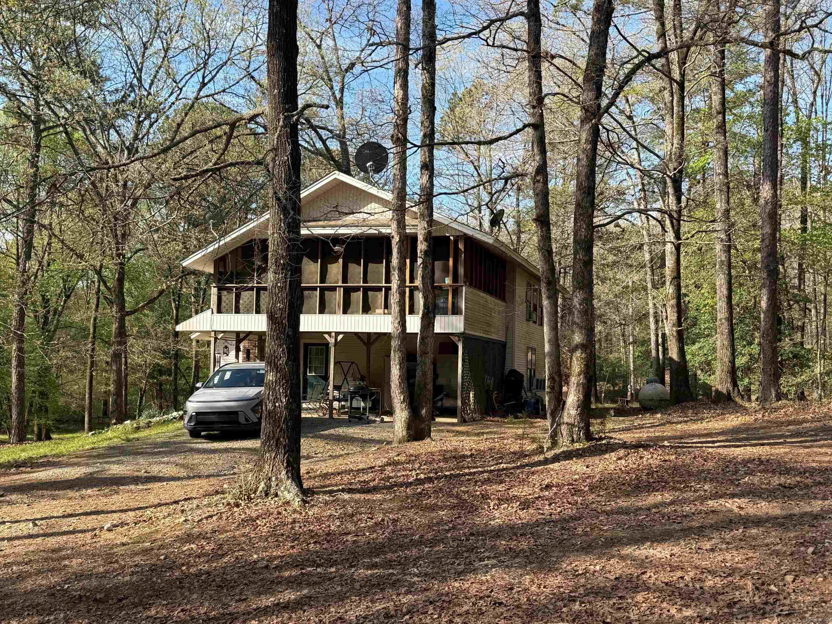 Really Nice Rural Residential Home with 9.83 acres and a Fantastic Creek located just off of a paved road just East of Vandervoort.  This 3 bedroom , 1 1/2 Bath Home is set in a wooded park like Property with a nice little Pond!  The Home has a deck off the upstairs which overlooks the Year around flowing Creek with twin waterfalls!  The 2 car carport is attached to the house and is very convenient!  This Property is located within 3 miles of the Cossatot River State Park, 1 mile from the Ouachita National Forest, 6 miles from the Ed Banks access on the Cossatot River and 9 miles from the Caney Creek West Trailhead.  This property is the perfect Home base for lots of great oudoor adventures.  The private driveway has an excellent view of the woods and Camp Creek.  The trees are mostly harwood and mast producing which draws lots of wildlife to this property!