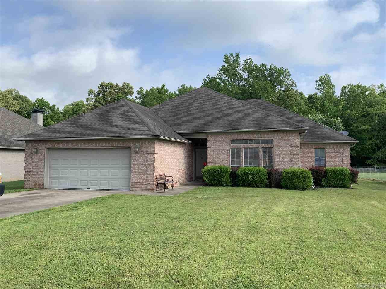 Enjoy the serenity of a culdesac and oversized lot with woods behind you!  Home has gracious living space and great bedrooms sizes. ALL bedrooms have walk in closets!  No carpet for easy care (except closets).  New garage door just installed.  Seller is also replacing entire roof asap. Corner fireplace with gas starter. Master bedroom features jetted tub, separate shower and double vanity sinks. Kitchen is open with breakfast bar. Refrigerator stays. Extra storage in laundry room. For comps, see agent notes