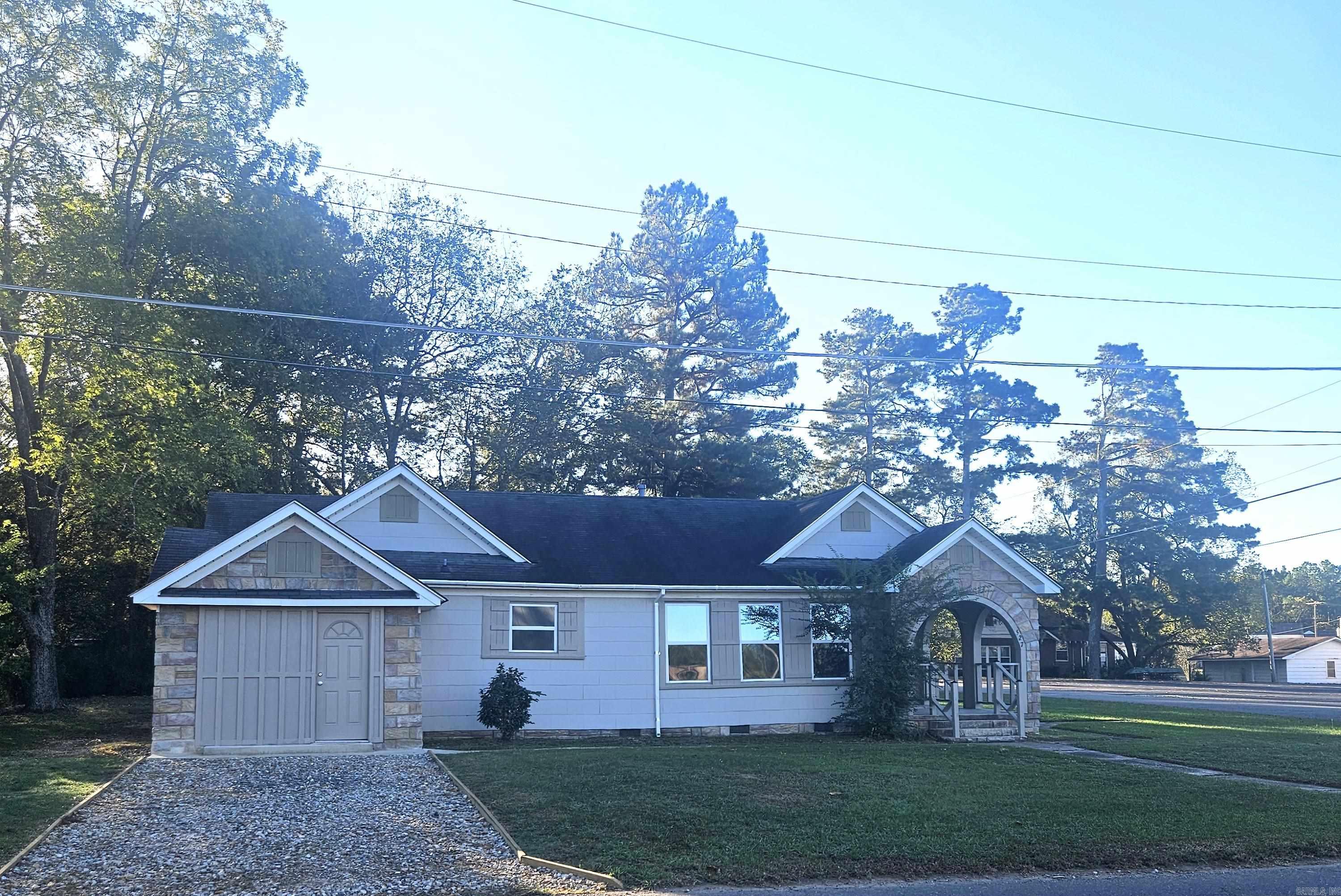 Check out this charming 3BR/1.5 BA home that is located on a corner lot and conveniently close to the downtown area. The exterior features beautiful archways, a covered porch that add to its curb appeal.  Inside, you will find a large kitchen with plenty of counter space. updates include energy-efficient E-Low glass windows, a new hot water tank, fresh interior paint, added closet and storage space, a new vanity in the main bathroom, and a new commode and wash tub in the half bath. This home offers comfort, character, and convenience all in one.