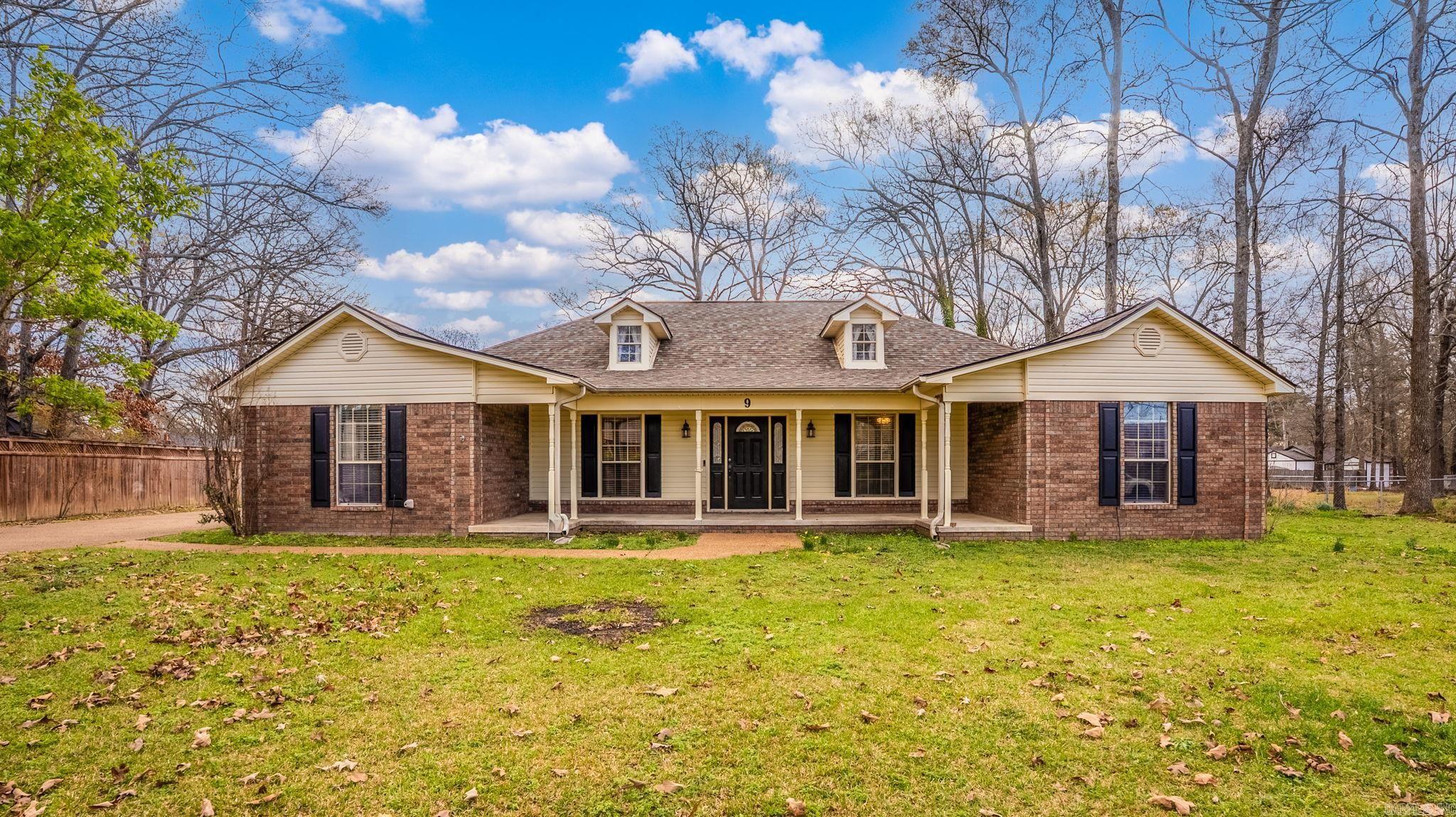 NEW ROOF AND A DETACHED SHOP! Be sure to watch the video walkthrough! Tucked into the heart of Greenbrier, this beauty has the space your family has been looking for!  Step inside to a spacious living room with tall ceilings, tons of natural light, and a cozy electric fireplace. Just beyond, the huge kitchen and dining area offers plenty of room to gather, host, and spread out. You’ll also love the sunroom just off the living room, perfect for sipping coffee while soaking in backyard views year-round.  The home features new flooring, newer paint and fixtures, and a brand-new roof (2025), giving you peace of mind and a fresh, modern feel. The primary suite includes a beautifully updated bathroom with stunning stone shower floors, while the oversized laundry room comes complete with a sink and extra storage space.  Out back is where this home really shines. A large deck, gazebo, sprinkler system, and lush landscaping create a private outdoor retreat. Plus, you’ve got a 2-car carport, storage building, AND a large detached 2-car garage with electricity, which is perfect for hobbies or projects. Make sure to schedule time to take it all in!