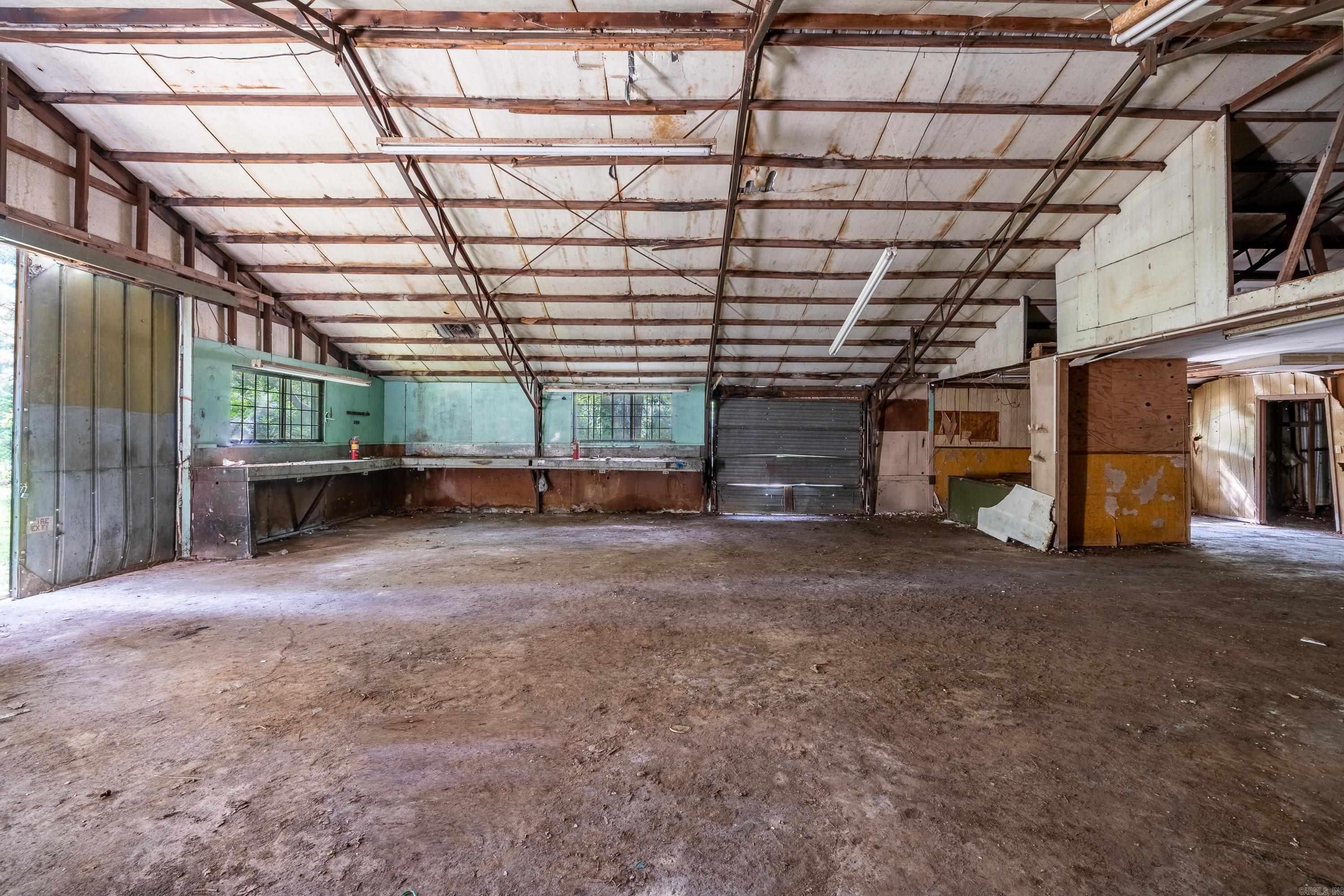 Perfect location for an auto repair shop, welding shop, offices or turn into apartments. This property has perfect access between Jacksonville and Cabot with easy access to the freeway and minutes to shopping and town!! Sits outside city limits and zoned for commercial. There is additional lot next door available for more land. Sold AS IS.