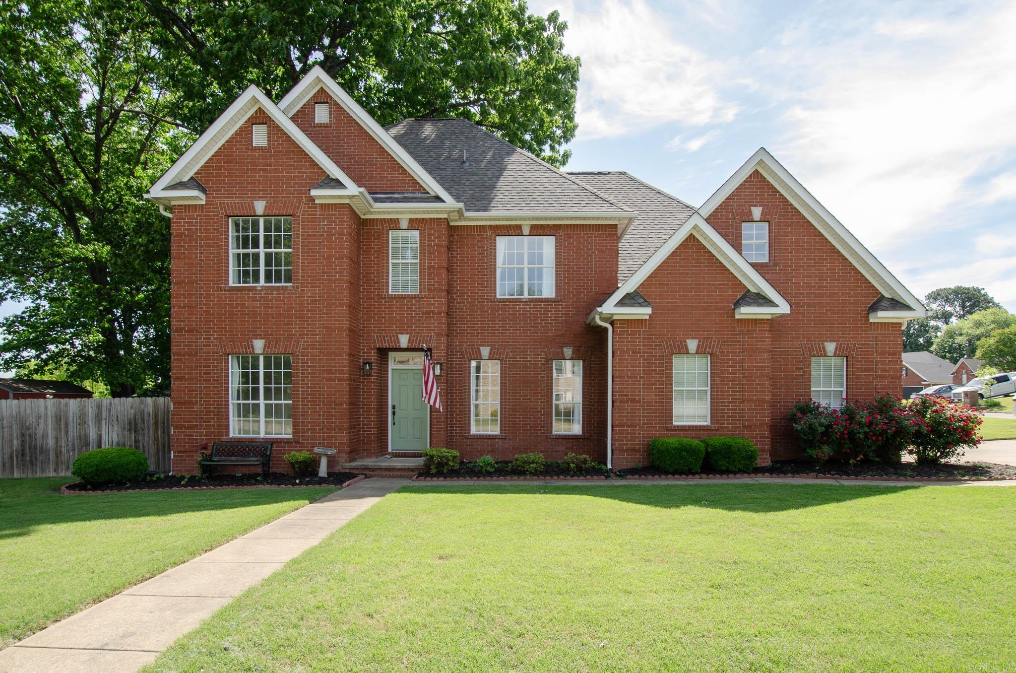 A classic brick exterior and an updated interior make this the perfect balance of charm and functionality.  4202 Stephanie Lane is a traditional two-story home with timeless curb appeal on a corner lot with a fenced backyard. Inside, you'll find pine hardwood floors, fresh paint, and an inviting 4-bedroom, 3-bathroom layout.  The kitchen, updated in 2025, features new countertops, painted cabinetry, a tile backsplash, and updated fixtures. Smart thermostats help keep the home energy efficient, and fresh lighting and updates throughout add a modern touch.  Outside, the home has been well maintained with newer gutters, and nice landscaping including knockout roses in full bloom! An air-conditioned workshop with electricity provides extra space for storage or projects year-round.  Located in a quiet, established neighborhood, this move-in ready home is ready for a new family to fill it with love and memories.  Sellers will provide a 14-month warranty from Home Warranty Inc with an acceptable offer!