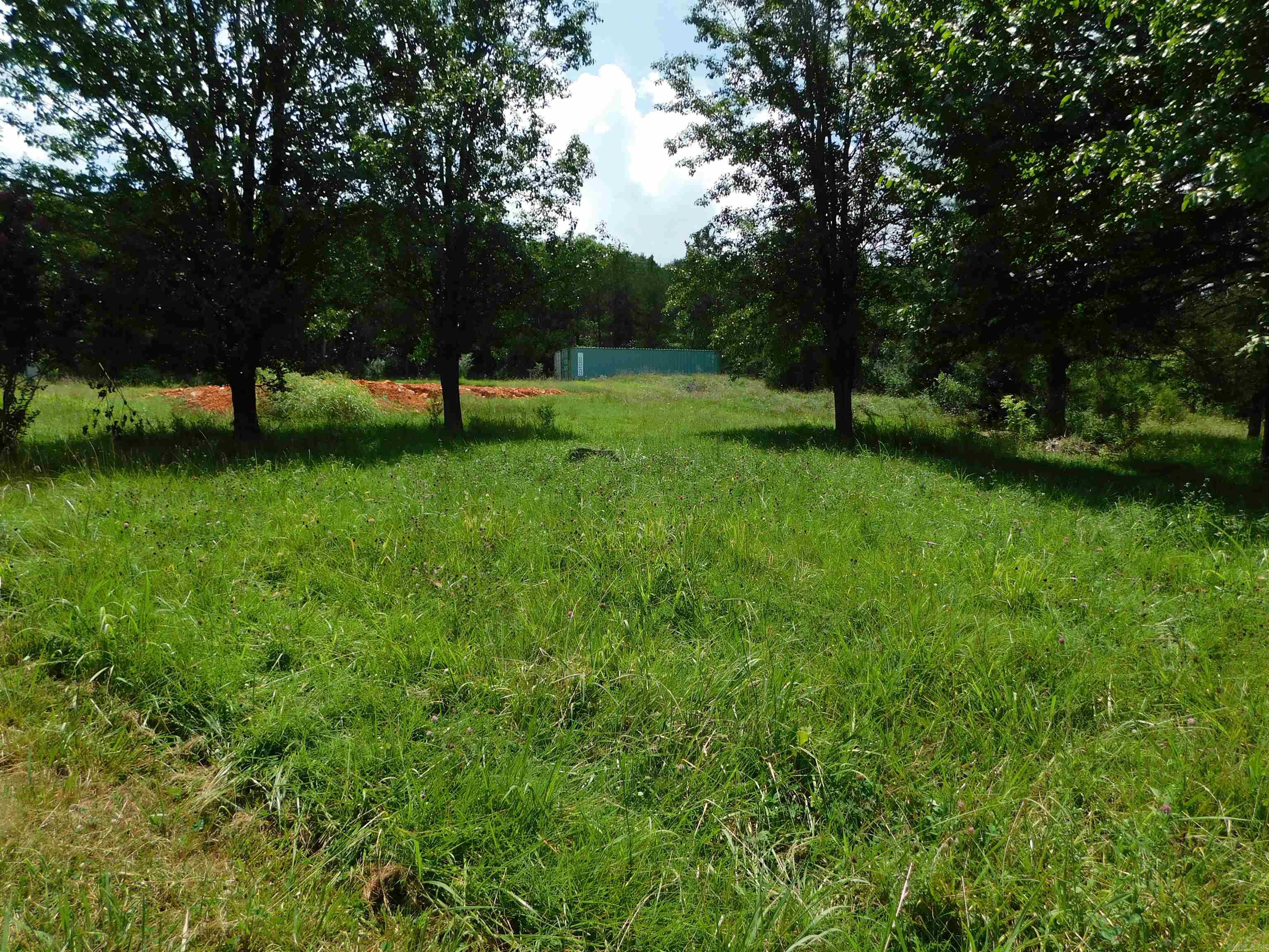 PARTIALLY WOODED 1-acre M/l corner lot with utilities on site, located on the edge of the charming town of Norfork. Enjoy the best of both worlds – peaceful small-town living with quick access to local favorites. Just under a mile to restaurants, a local brewery, unique shops, and the public launch ramp to the world-famous White River, known for its incredible trout fishing. This particular level lot offers the perfect spot to build your dream home, weekend getaway, or investment property. Don’t miss this rare opportunity in one of the Ozarks’ hidden gems! Buyer to verify all measurements and city ordinances.