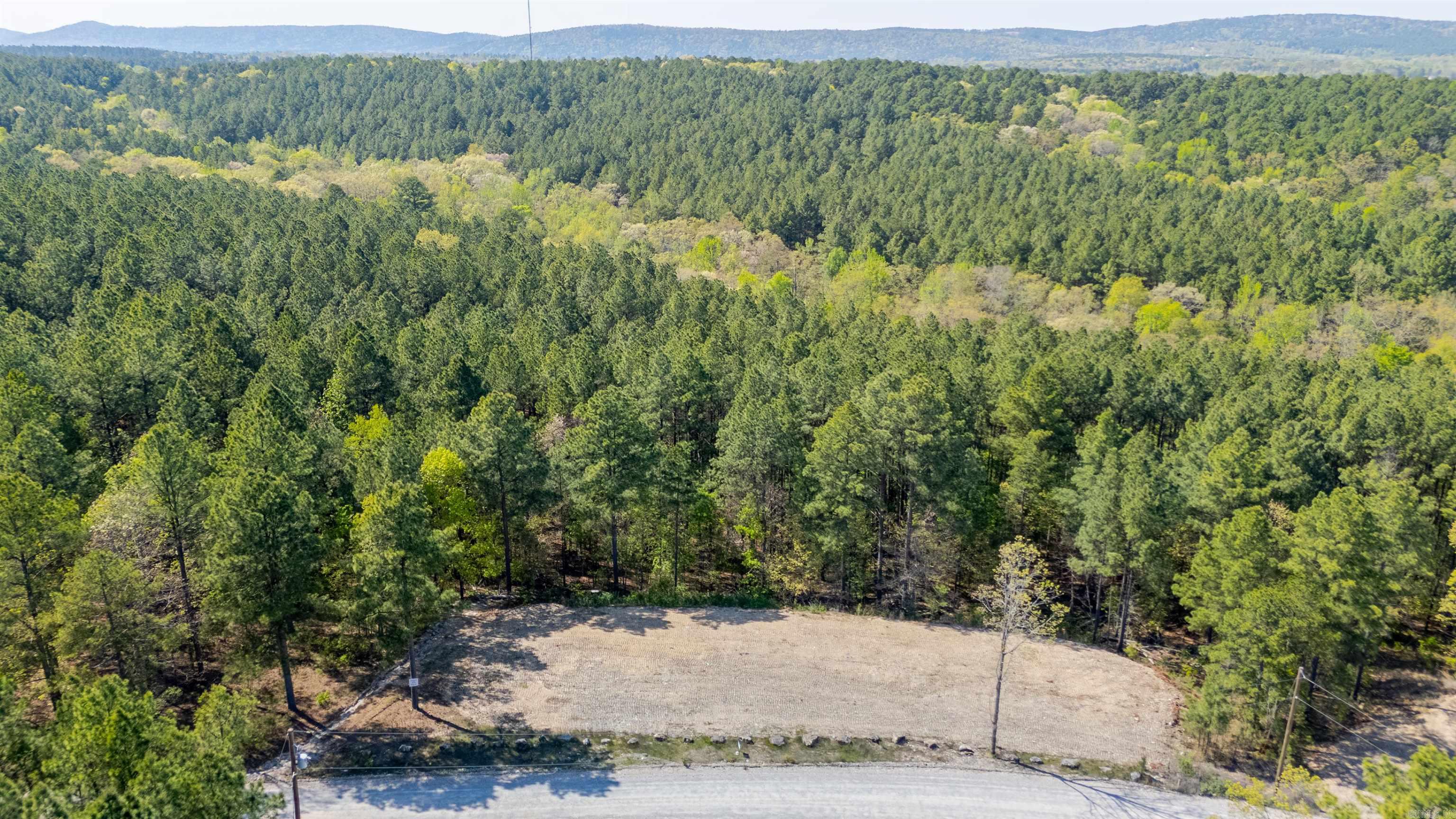 BUILD YOUR DREAM HOME ON 3 ACRES IN PRIME LOCATION. EASY ACCESS TO HOT SPRINGS VILLAGE THROUGH GLAZYPEAU GATE--ASK ABOUT HSV PRIVILEDGES FOR THE BEST OF BOTH WORLDS! COVENANT PROTECTED AREA WITHOUT HOA FEES! HORSES ALLOWED! TRACT 15 & 17  NEXT DOOR ARE ALSO AVAILABLE FOR A TOTAL OF 9 ACRES IF DESIRED. ALL TRACTS HAVE A LEVEL DIRT PAD IN FRONT TO JUMPSTART YOUR BUILDING PROCESS.