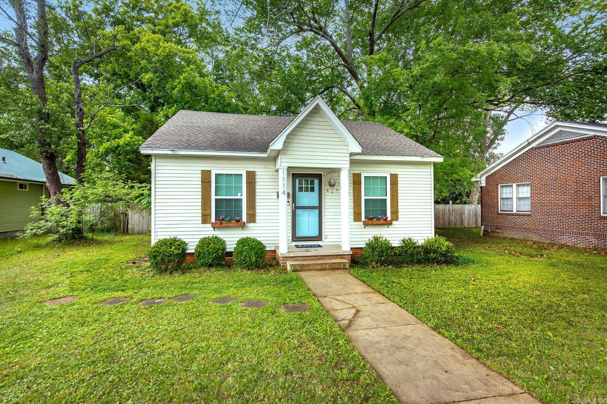 Charming and full of character, this cute bungalow is perfectly located near schools and colleges, offering both convenience and comfort. Featuring 2 bedrooms & 1 full bath, this home boasts beautiful hardwood flooring throughout, creating a warm & inviting feel in every room. Enjoy a spacious living & dining area, ideal for relaxing or entertaining. Step outside to a fenced backyard-perfect for pets, gatherings, or simply unwinding-complete with a storage building for all your extras. Whether you're a first-time homebuyer or looking for a great rental investment, this delightful home checks all the boxes! in 2021 roof replaced, new windows, wiring and plumbing, all new sheet rock, new exterior doors and quartz countertops.  Call toady for private showing.