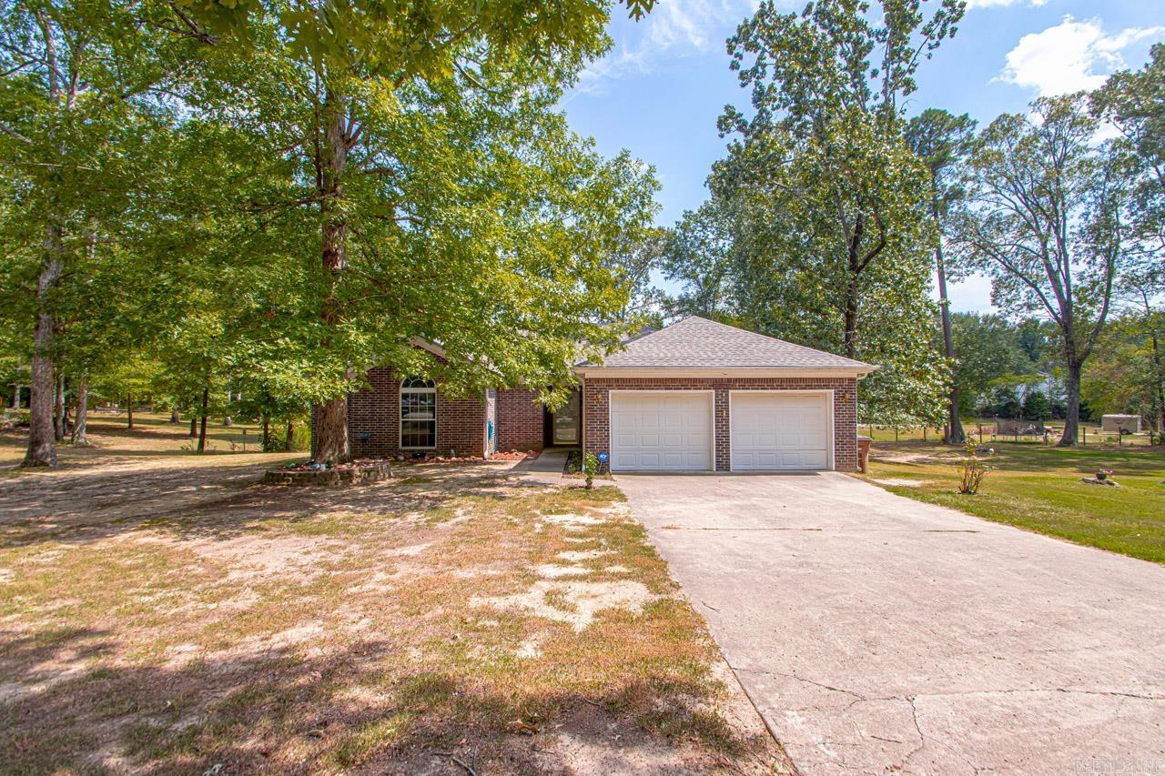Charming one owner home in the heart of East End Community. Home has 3 bedrooms, 2 full bathrooms. Entryway as you walk in front door. Large living room with open dining and partial kitchen. Kitchen has a bar. Walk in pantry. Large laundry room. Master Bedroom is huge. Master bath features a Large tub, two closets, vanity area and two sinks, separate area for toilet. The two car garage is very roomy. Large yard, approx. 1.64 acres. SHOP 24 X 30. Covered carport with storage behind it.  ***The fireplace mantle does not convey, but there will be one replacing it***