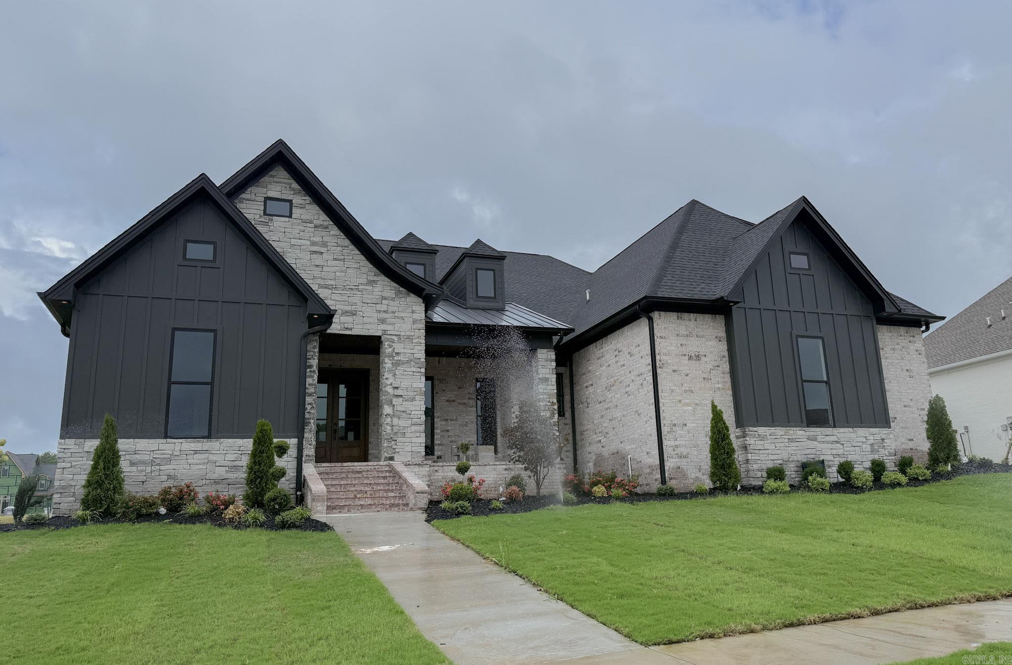 Stunning new construction home with modern finishes! Will be completed by end of June 2026, this home has so much to offer. Gold fixtures on the inside, luxury tile flooring and showers throughout, stained beams and accents, custom shelving and cabinetry. Don't miss the opportunity to live in the sought after Lands End community!