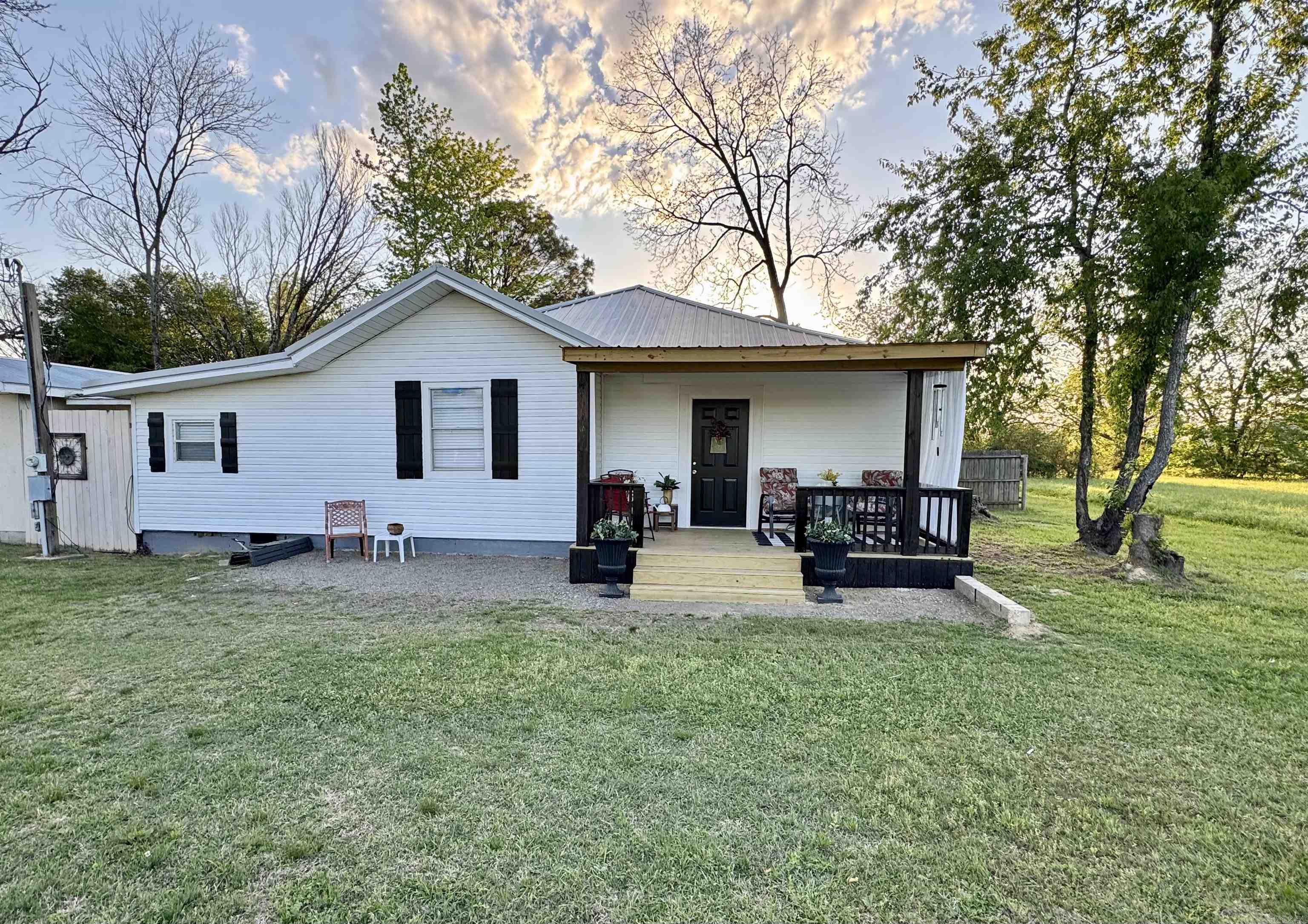 Residential/Commercial opportunity with partial owner financing available and 1031 exchange potential. This versatile property features high-visibility highway frontage and excellent development potential in a growing area. Situated on approximately 0.88 acres, the property includes a 2-bedroom, 1-bath home with a 1-car garage, carport, and a 20x70 two-bay shop ideal for business use, storage, or a workshop. With flexible potential uses, this property could accommodate a small business, tiny home development, RV park investment (long-term or extended stay), or a small livestock homestead. Conveniently located just 4 minutes from Lake Overcup and a short drive to Lake Brewer, with quick access to Interstate 40 and an easy commute to Conway and Little Rock. Area growth continues to expand with major economic development, including the historic $1 billion Green Bay Packaging expansion in Morrilton, increasing demand for housing, services, and investment opportunities. Close to shopping, dining, and outdoor recreation, including Petit Jean Mountain. Schedule your showing today; opportunities like this are rare.