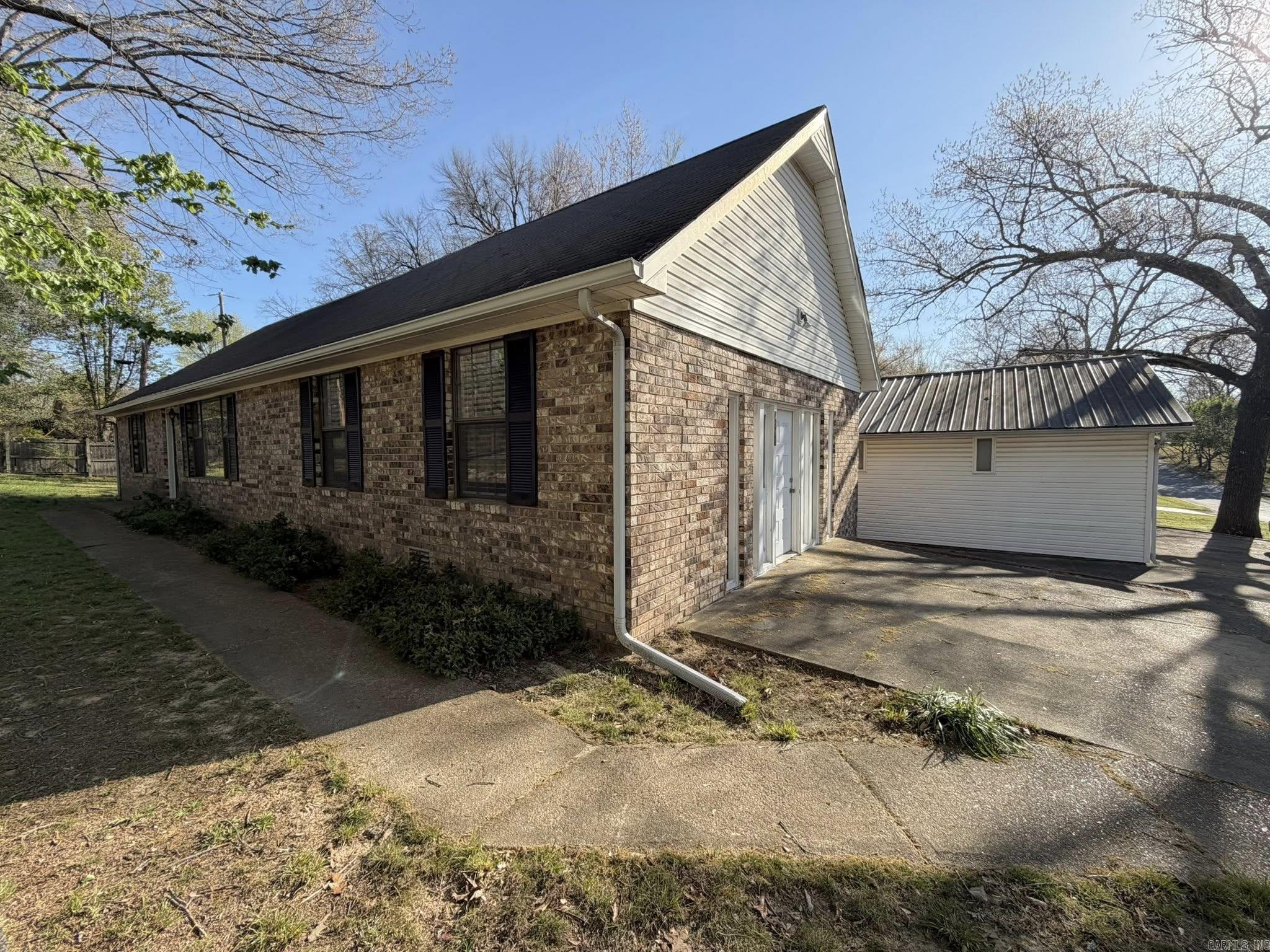 Charming brick home with 4 bedrooms and 2 baths, featuring 2 bedrooms on the main floor and 2 upstairs. Enjoy a large family room with a woodburning fireplace, perfect for relaxing or entertaining. This property also includes a 2-car detached garage with a workshop on the back, as well as a second detached storage building for added convenience. Built in the 1980s, this home is full of potential and ready for your personal touch. With a roof replaced 6 years ago and a location close to downtown Batesville, this could be the perfect opportunity to create the home you’ve been waiting for.