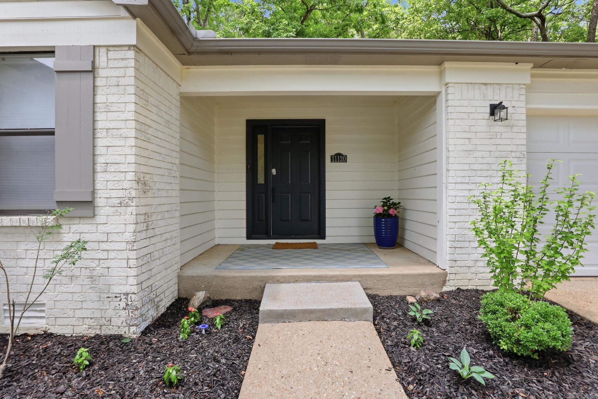 Beautifully refreshed and move-in ready, this 3-bedroom, 2-bath home in West Little Rock offers a warm, stylish feel with thoughtful updates throughout. Step inside to neutral interiors, updated flooring, recessed lighting and comfortable living spaces that feel both polished and inviting. The bright kitchen features white cabinetry, stainless steel appliances, gas range, tile backsplash, generous storage and an adjoining dining area framed by large windows overlooking the wooded backyard. Large living room with vaulted ceiling and fireplace. Adjacent to it is a perfectly sized office. The spacious primary suite includes an updated bath with double vanity, sleek black fixtures and a walk-in shower. Two additional bedrooms offer flexibility. Bonus storage space over the garage. HEAT & AIR 2023, WATER HEATER 2026. Outside, enjoy mature trees, fresh landscaping, a 2-car garage, and a peaceful setting tucked into an established neighborhood. Walk to playground and pool! Convenient to shopping, dining, schools and all that West Little Rock has to offer. A wonderful blend of comfort, updates and LOCATION!