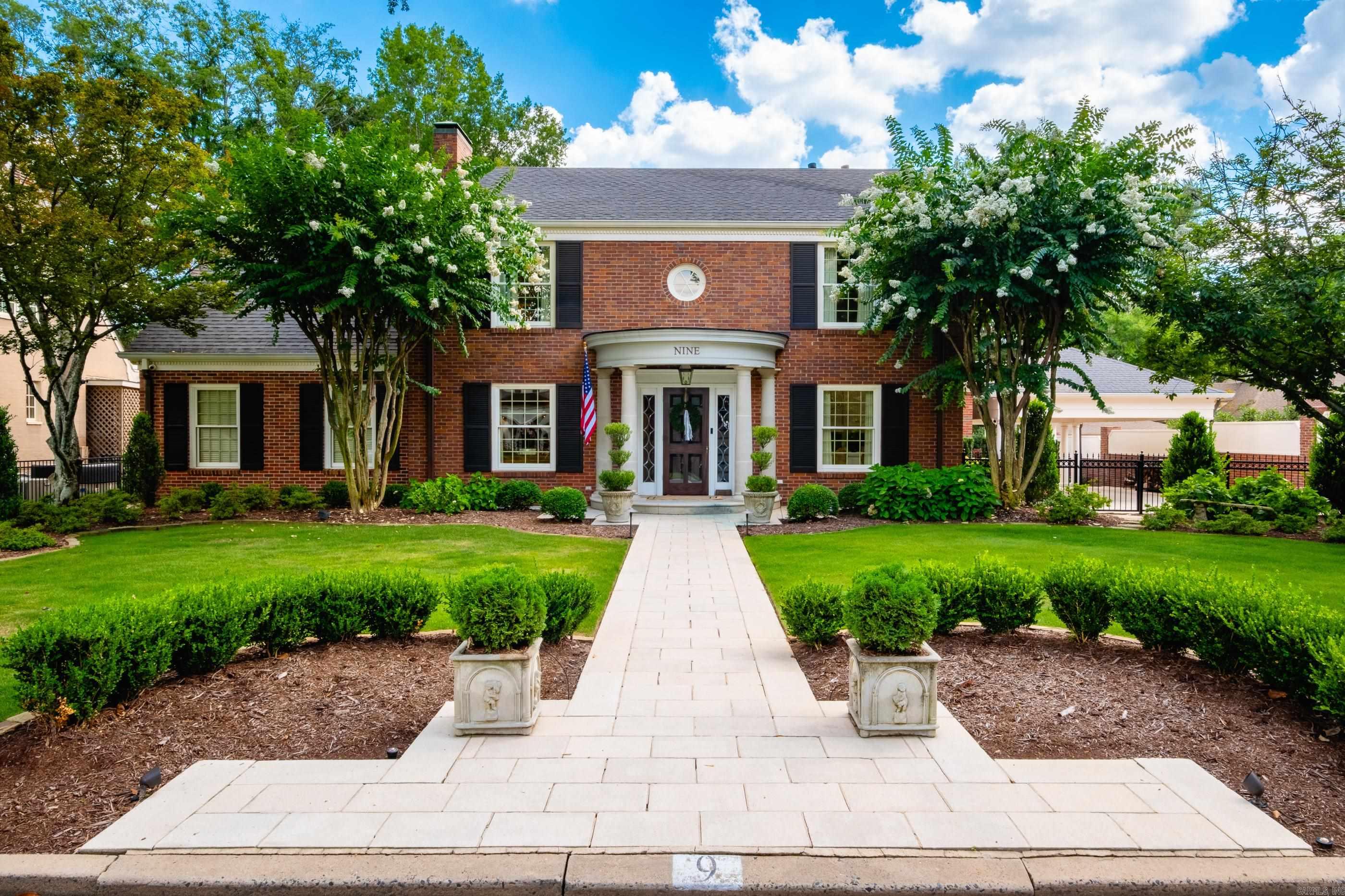 Timeless elegance meets modern luxury in this beautifully remodeled 1930s home on one of The Heights’ most prestigious streets. The main level features a formal living room anchored w/ a wood-burning fireplace & custom built ins, study with built-ins, & an open family room w/ gas fireplace. Designed for effortless entertaining the wet bar w/ ice maker, beverage fridge and wine cooler. The heart of the home is the spectacular chef’s kitchen w/ vaulted ceilings, an oversized marble island, premium appliances, wall oven & microwave, additional oven and gas cooktop w/pot filler & warming drawer. Complementing the kitchen is a large butler’s pantry and a separate prep (caterer's) kitchen with additional ovens, sink, and laundry area. The luxurious primary suite offers a spa-like bath w/walk in shower, tub, water closet & dual custom closets with enclosed wardrobe cabinetry. Half bath on main level as well. Upstairs are 3 guest bedrooms & 2 full baths. Outdoors, enjoy a gated two-car carport & a private backyard retreat w/ turf, putting green, gazebo w/ fireplace, hot tub, & charming storage cottage. An exceptional opportunity in one of Little Rock’s most sought-after neighborhoods.